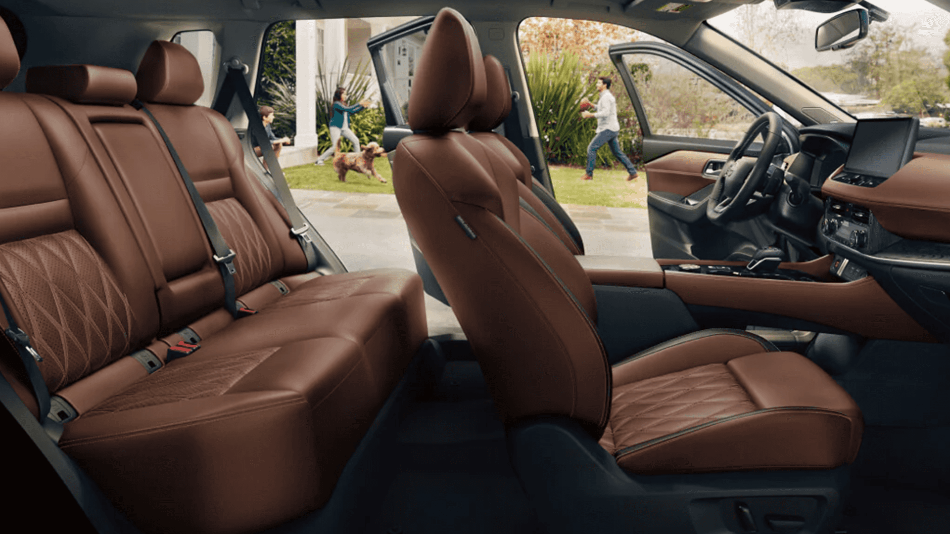 2026 Nissan Rogue cabin view highlighting the front seats, dashboard, and center display screen