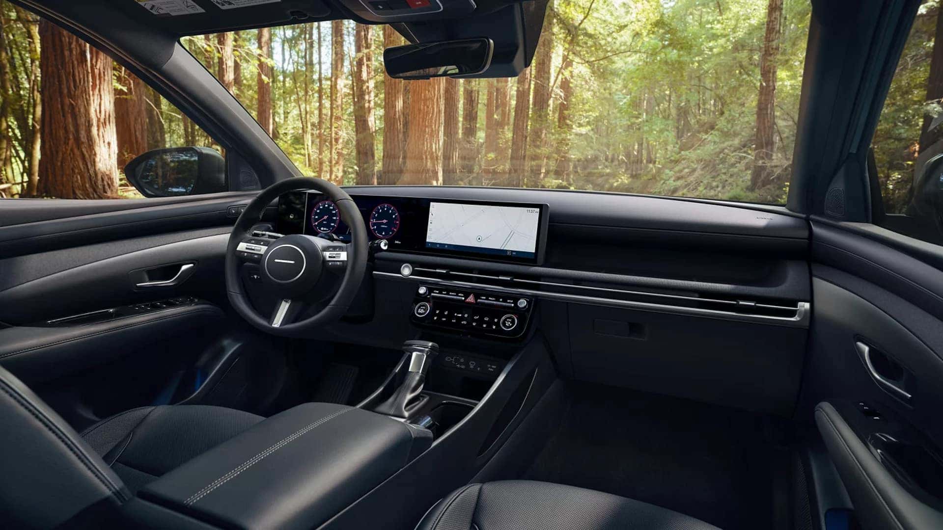 Wide dashboard view in the 2026 Hyundai Santa Cruz with large infotainment screen and digital instrument display