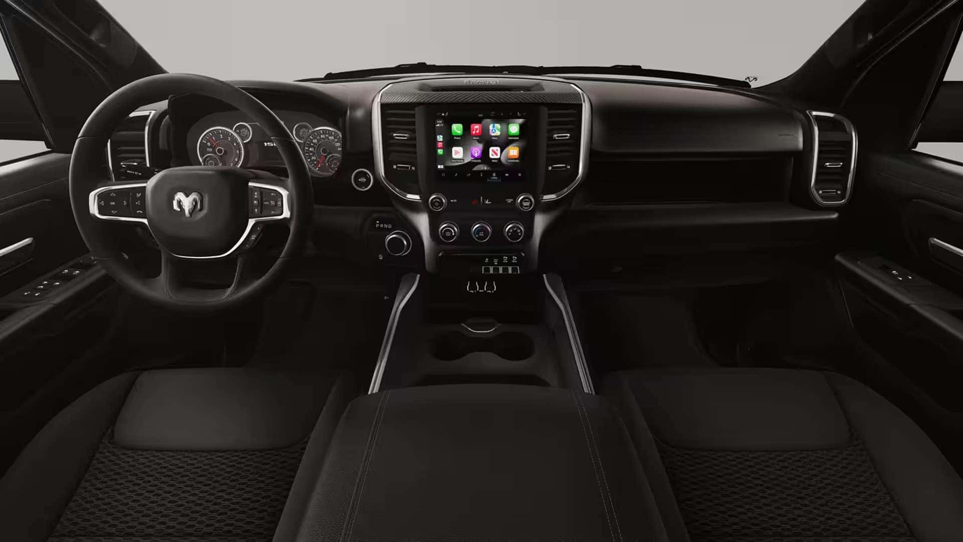 Interior cabin of the 2026 Ram 1500 showing dashboard layout, center touchscreen, and front seating