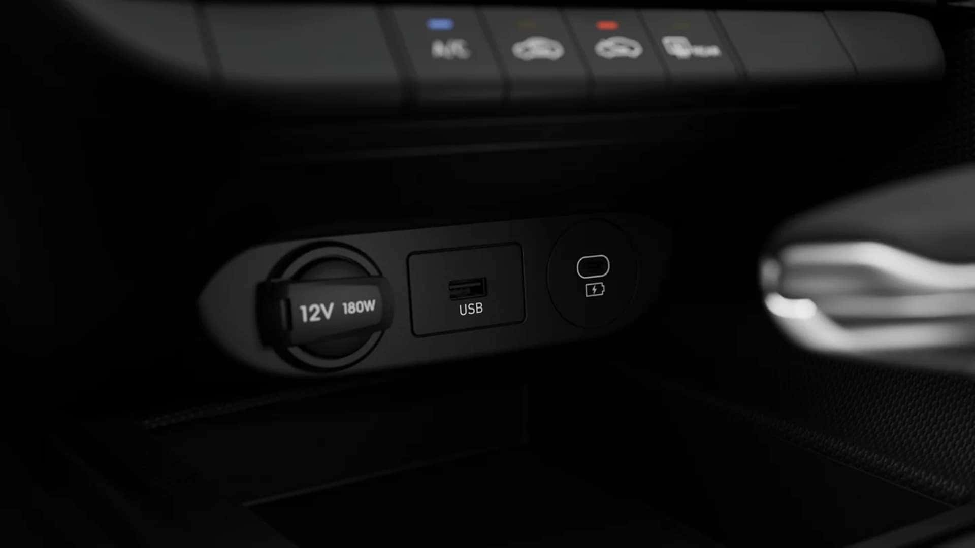 2026 Hyundai Elantra interior showing USB ports, 12-volt outlet, and wireless charging area for smartphone connectivity and device power