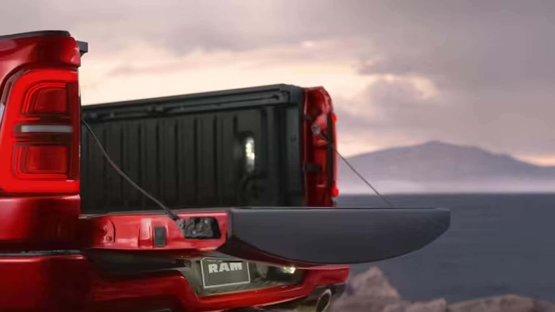 2026 Ram 1500 tailgate shown open highlighting bed access, integrated lighting, and rear exterior details