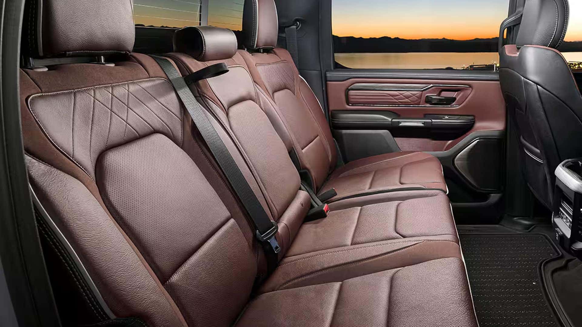 2026 Ram 1500 rear cabin seating with premium upholstery, stitched door panels, and spacious Crew Cab legroom