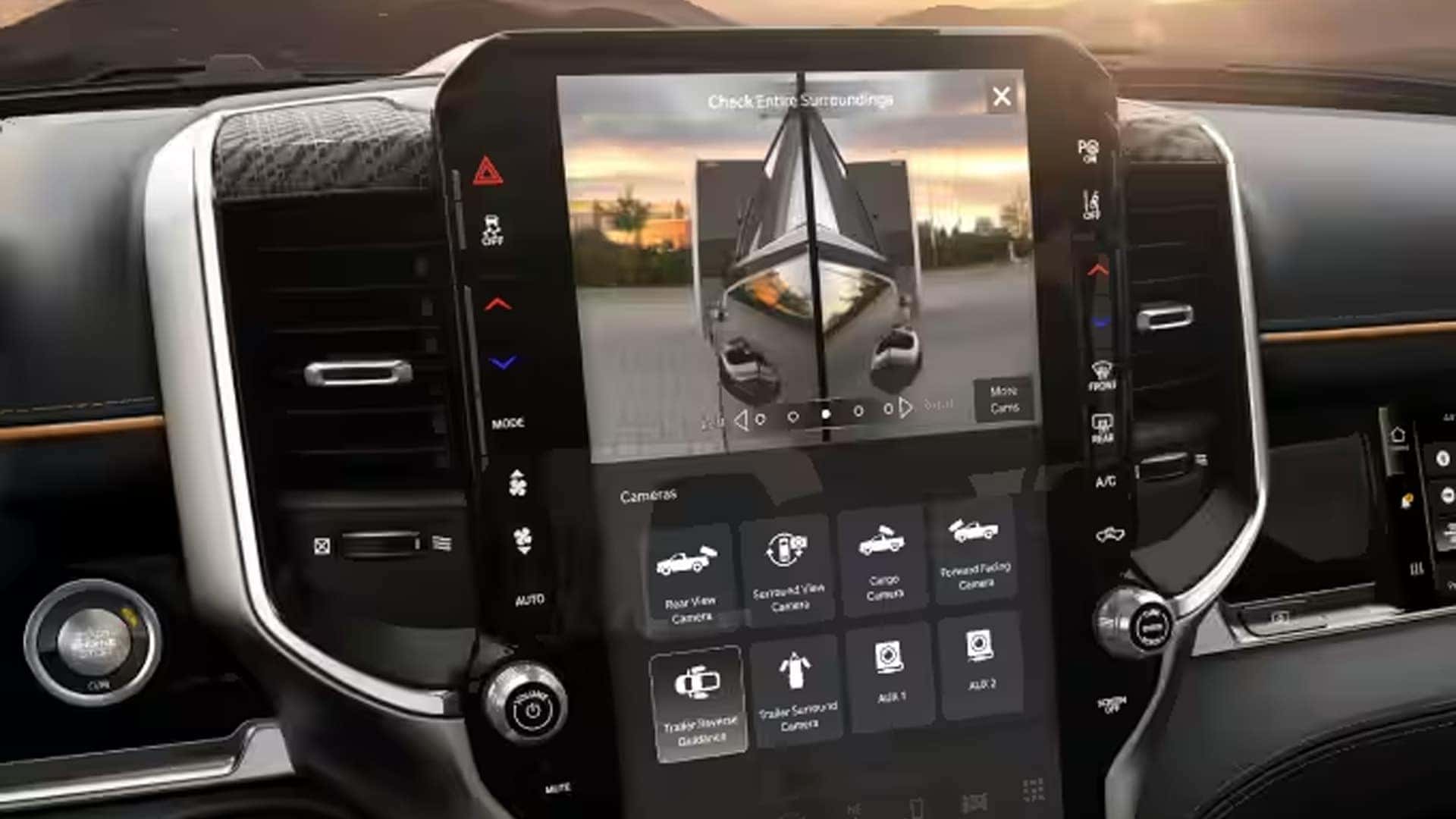2026 Ram 1500 center touchscreen displaying trailer camera views and towing assistance features for backing and alignment support