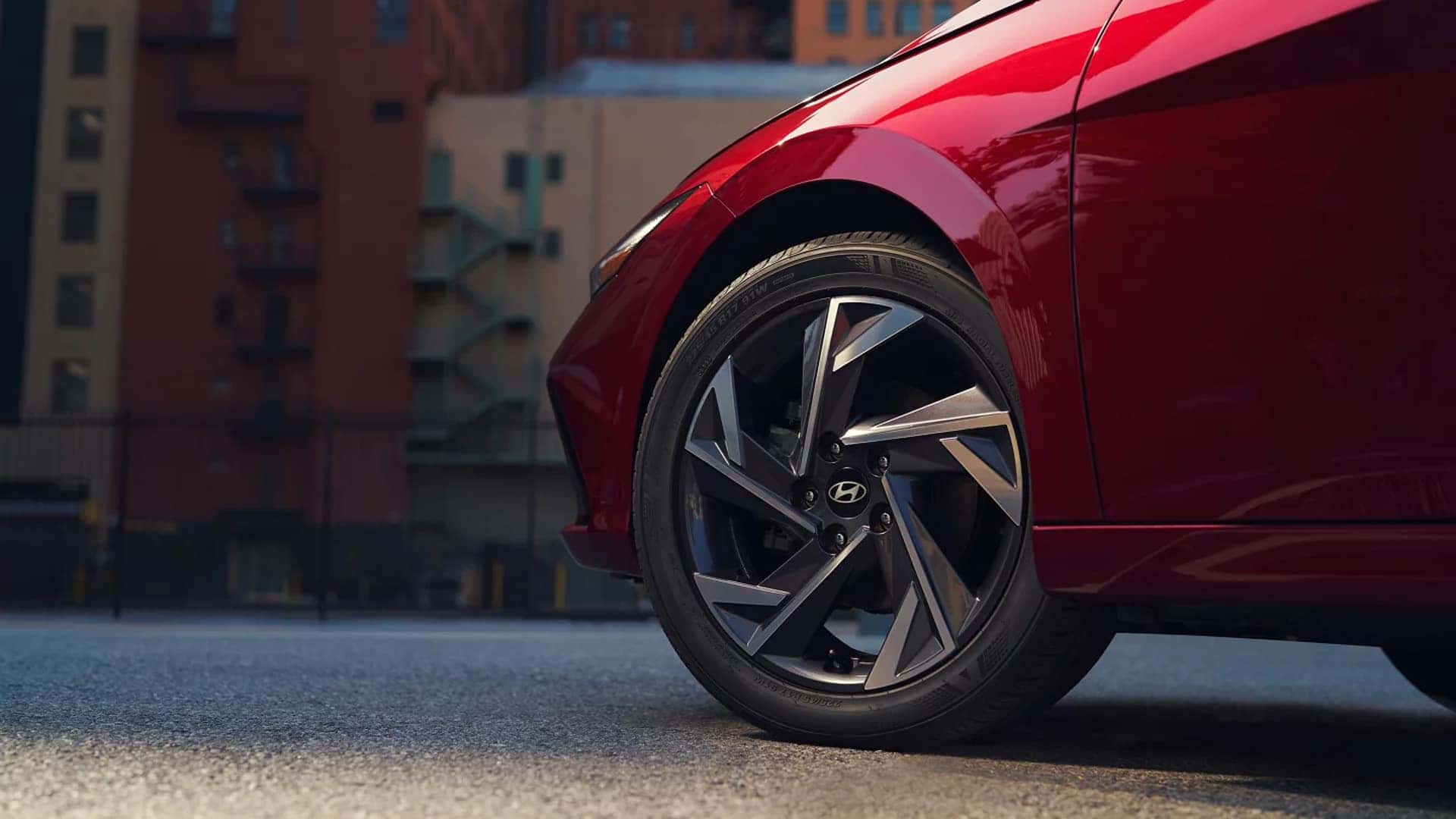 Close up of a 2026 Hyundai Elantra wheel and tire showing multi spoke alloy wheel design and exterior body color finish