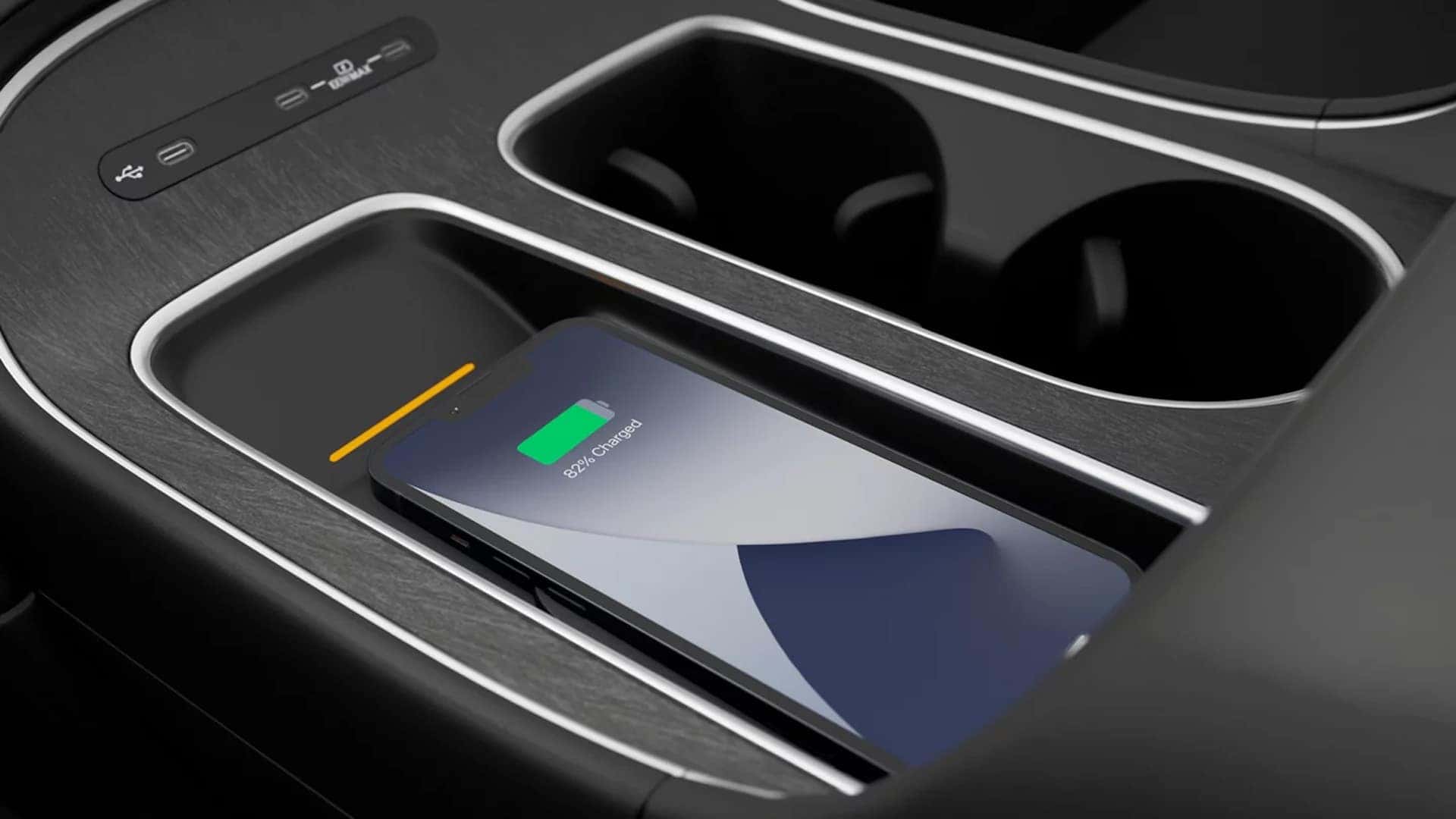 Wireless smartphone charging pad and USB C ports inside the 2026 Hyundai Palisade Hybrid center console