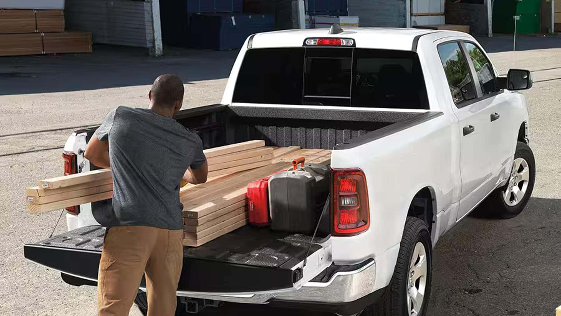 2026 Ram 1500 truck bed loaded with lumber and equipment demonstrating payload capability