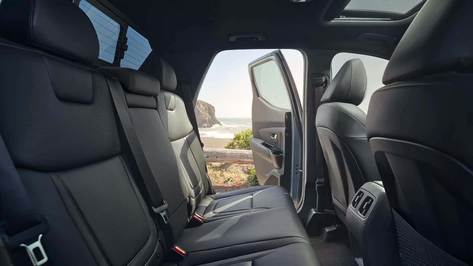 Rear seating area in the 2026 Hyundai Santa Cruz with roomy second row bench and rear air vents
