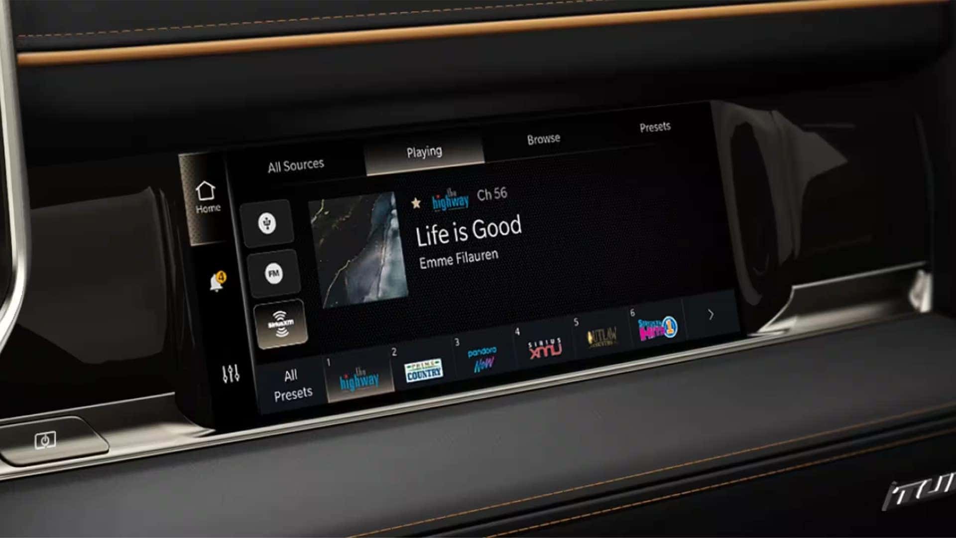 Wide interior view of the 2026 Ram 1500 showing the digital driver cluster, large infotainment touchscreen, passenger display, and premium interior trim