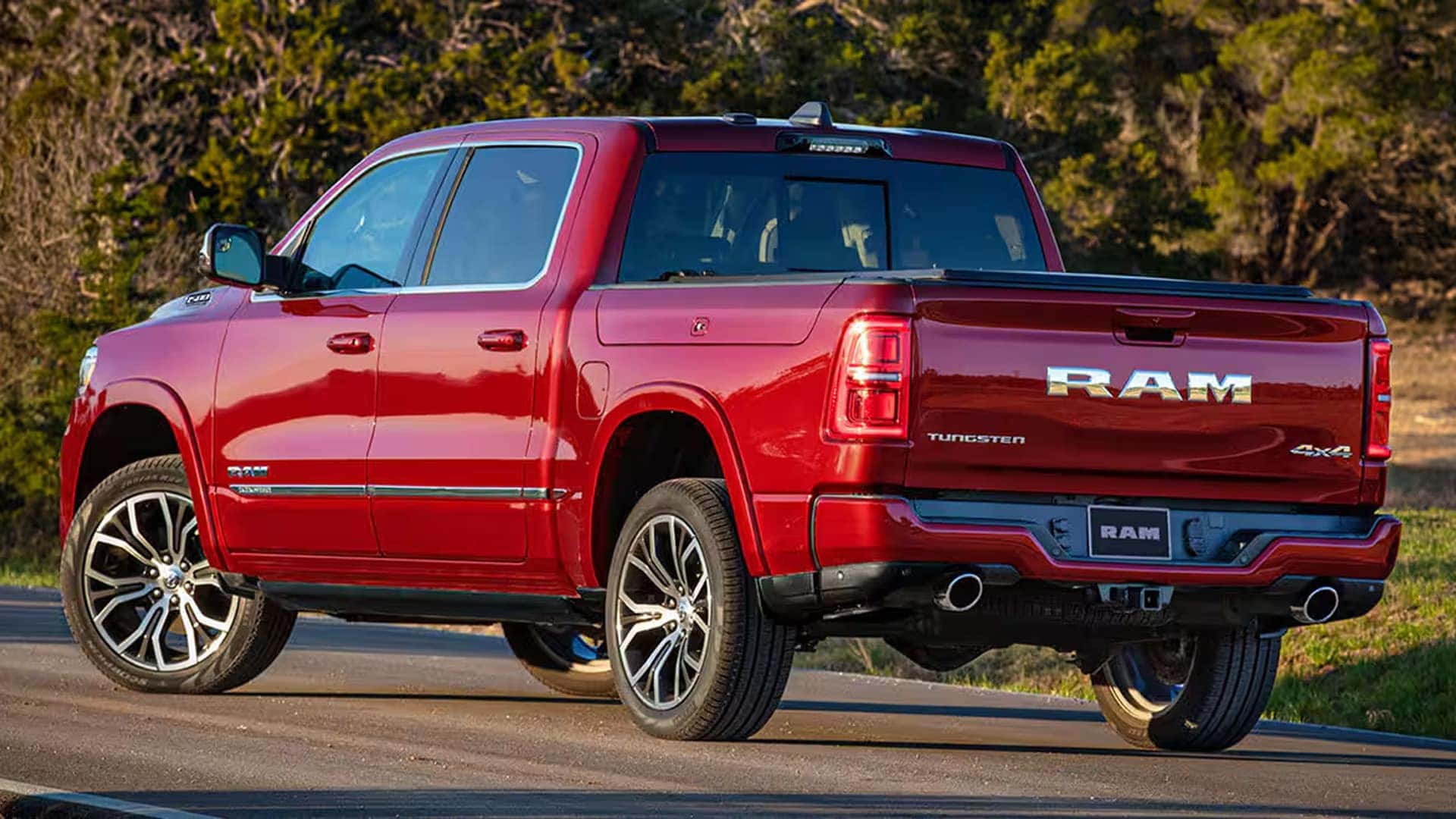2026 Ram 1500 Rebel trim displayed in blue with off road tires, unique grille design, and rugged exterior features