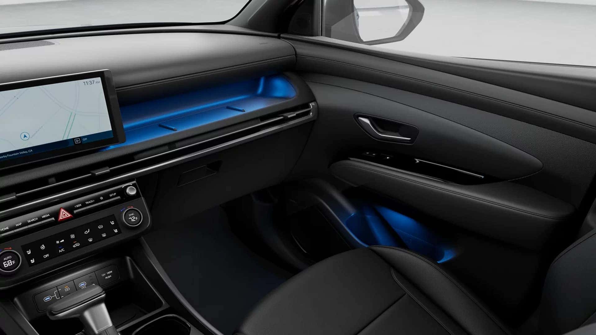 Passenger side of the 2026 Hyundai Santa Cruz interior featuring dashboard storage shelf and blue ambient lighting