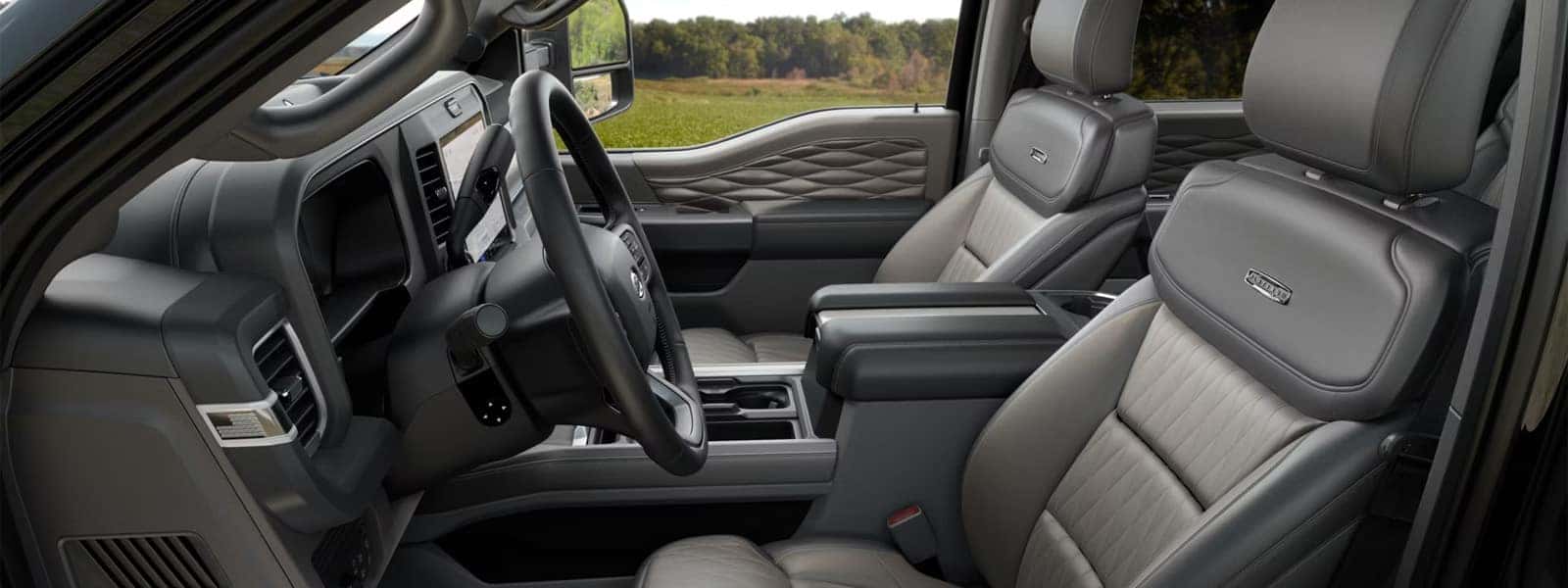 Interior view of the 2026 Ford F-250 Super Duty showing premium front seats, center console, and dashboard layout with large touchscreen display