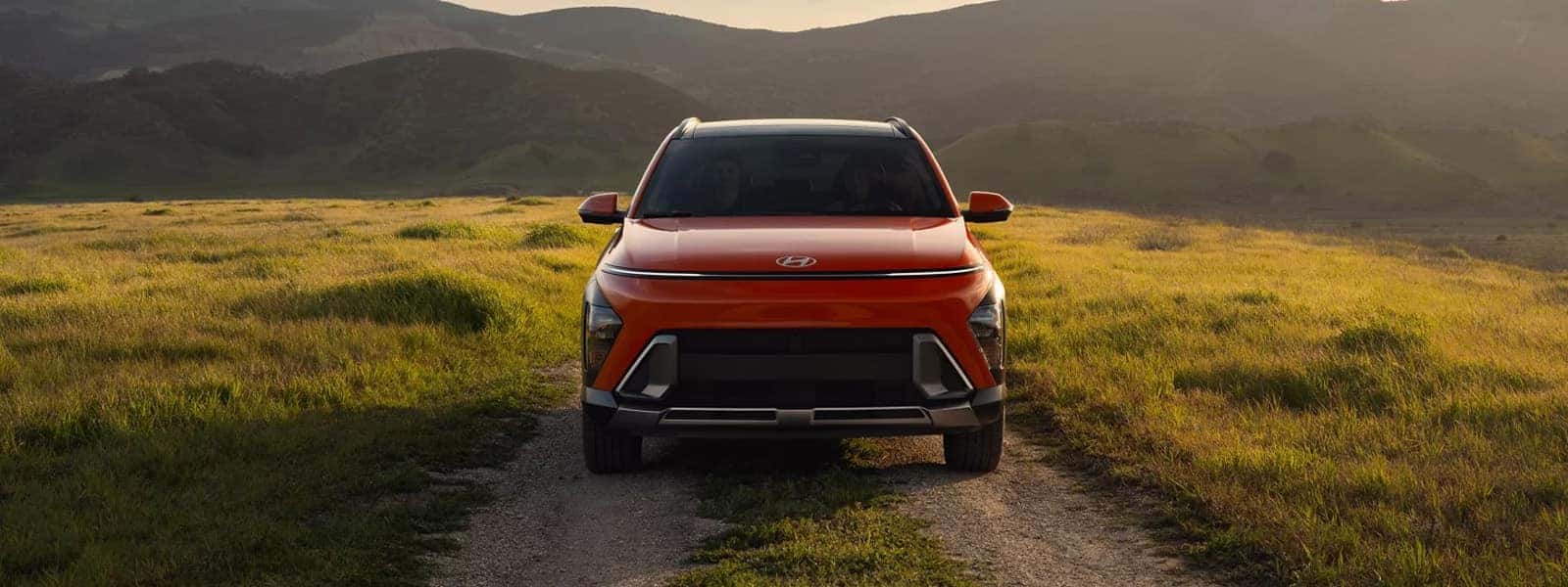 2026 Hyundai Kona parked on a dirt road with mountains in the background, front view