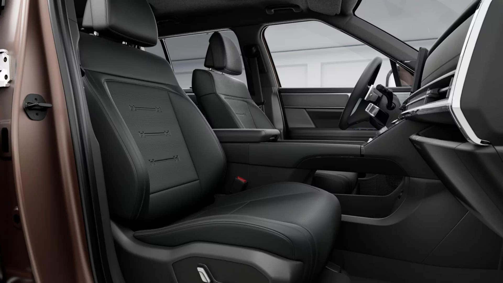 Driver focused cabin of the 2026 Hyundai Santa Fe interior with horizontal dashboard design, steering wheel controls, and center touchscreen