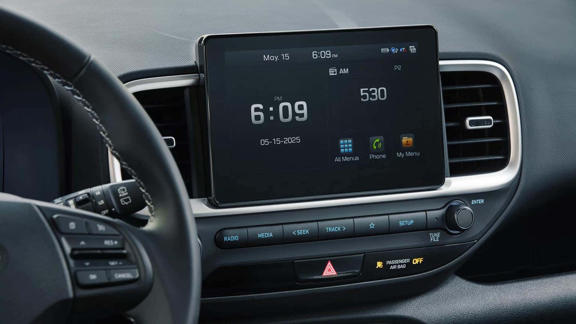 Close-up of the 2026 Hyundai Venue 8-inch touchscreen infotainment system with Bluetooth, phone, and menu icons displayed on the screen.