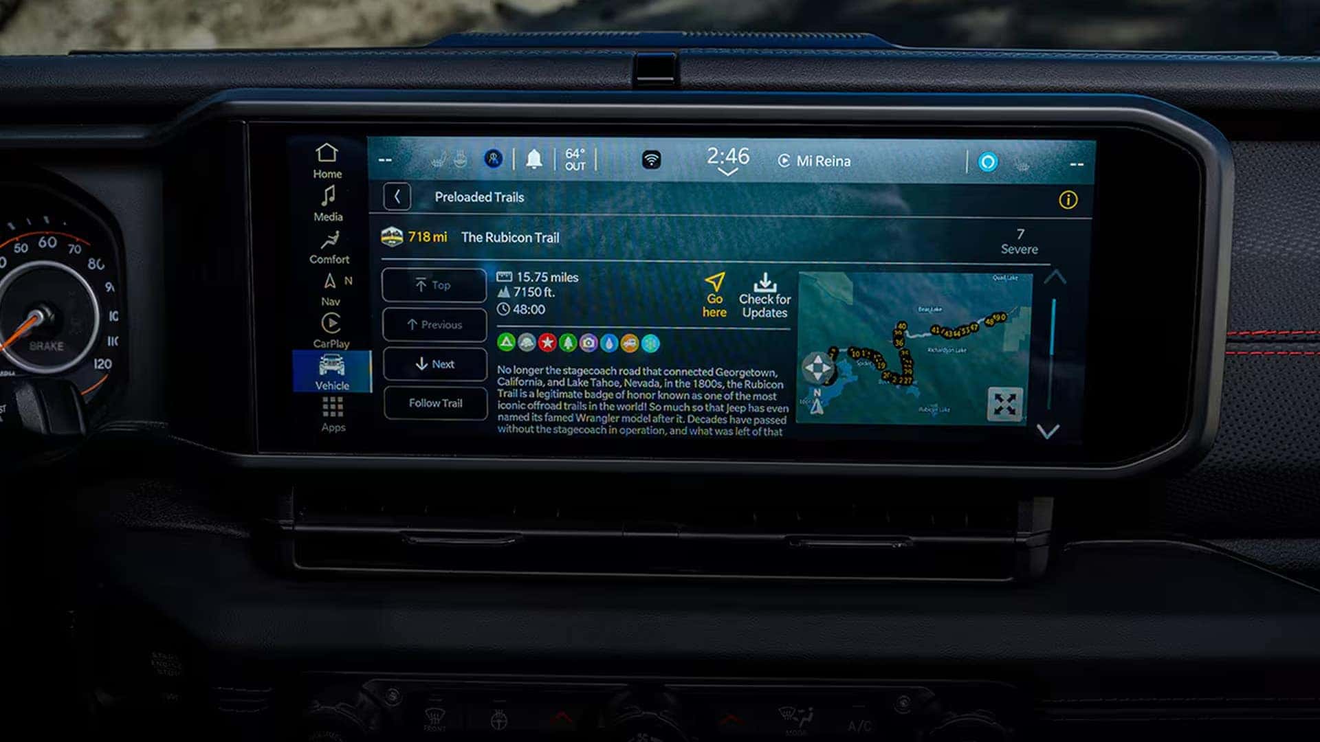 Close-up of the 2026 Jeep Gladiator 12.3-inch Uconnect touchscreen displaying integrated off-road trail guides and navigation interface