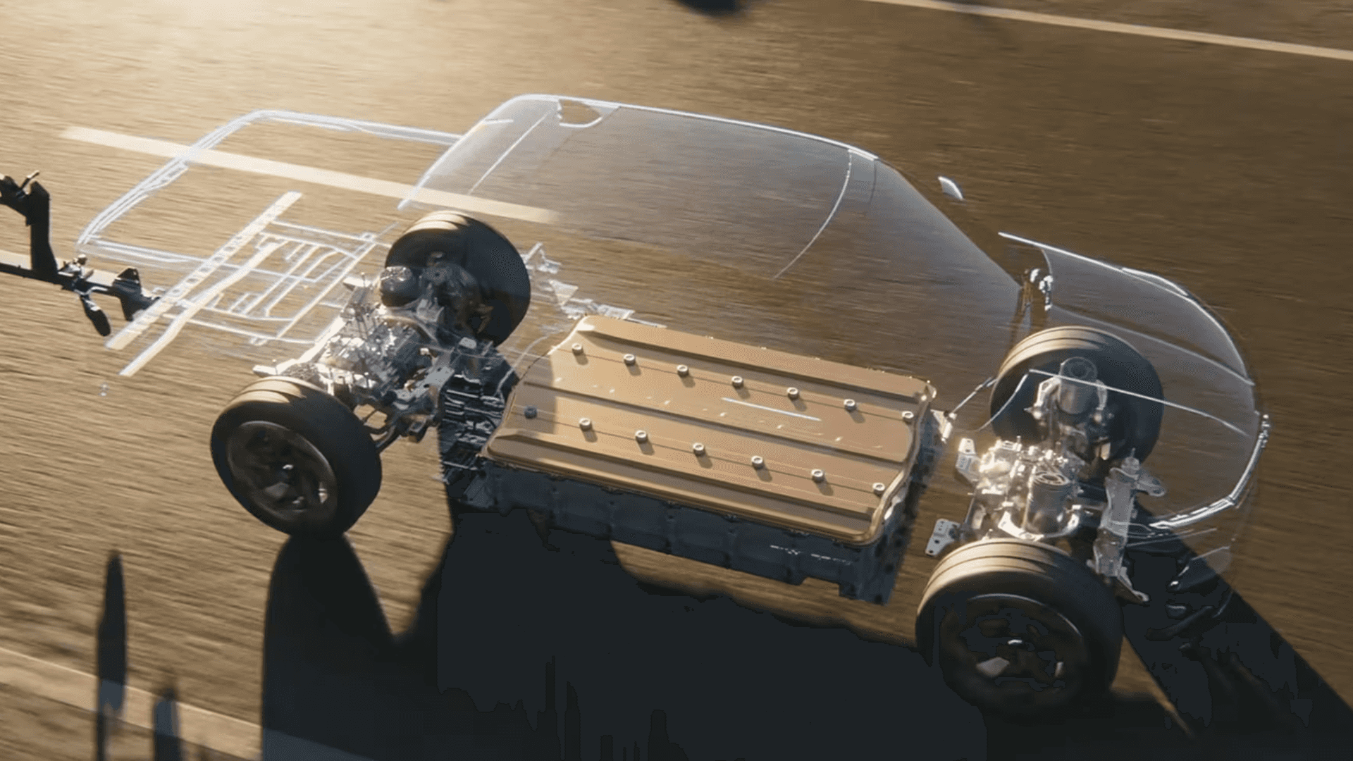 Transparent chassis view highlights Silverado EV battery pack and electric motors while driving on a roadway