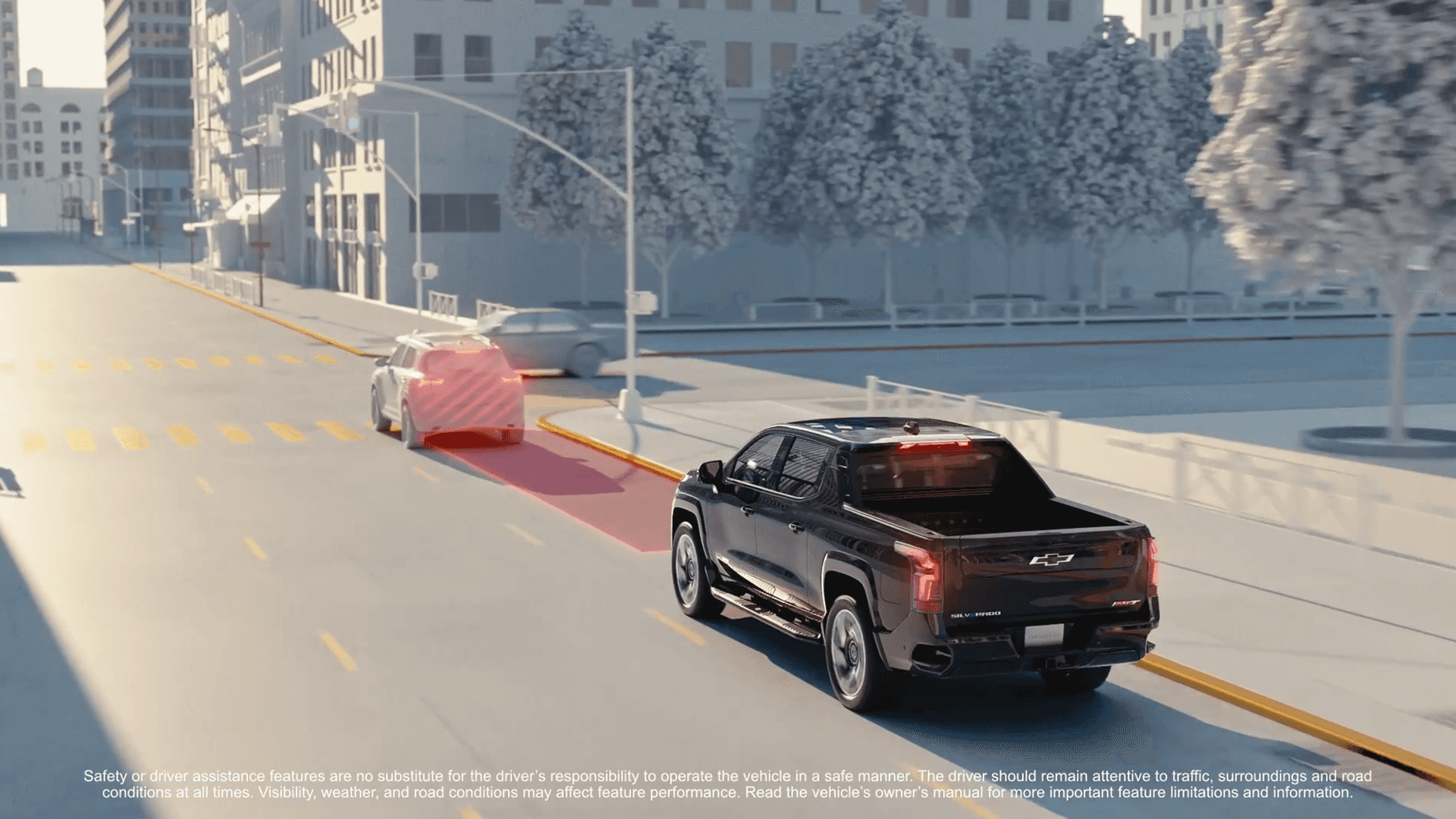 Silverado EV approaches vehicle ahead with red alert zone overlay, illustrating forward collision warning