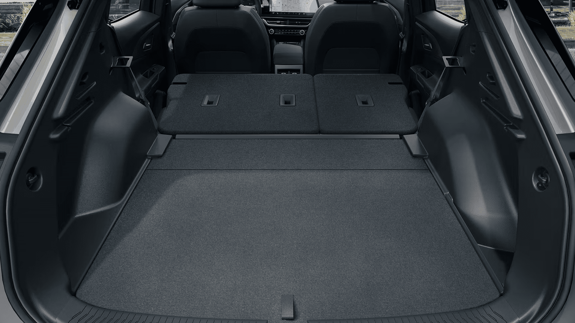 Rear cargo view with second-row seats folded flat in 2026 Equinox EV, creating a long, level load floor