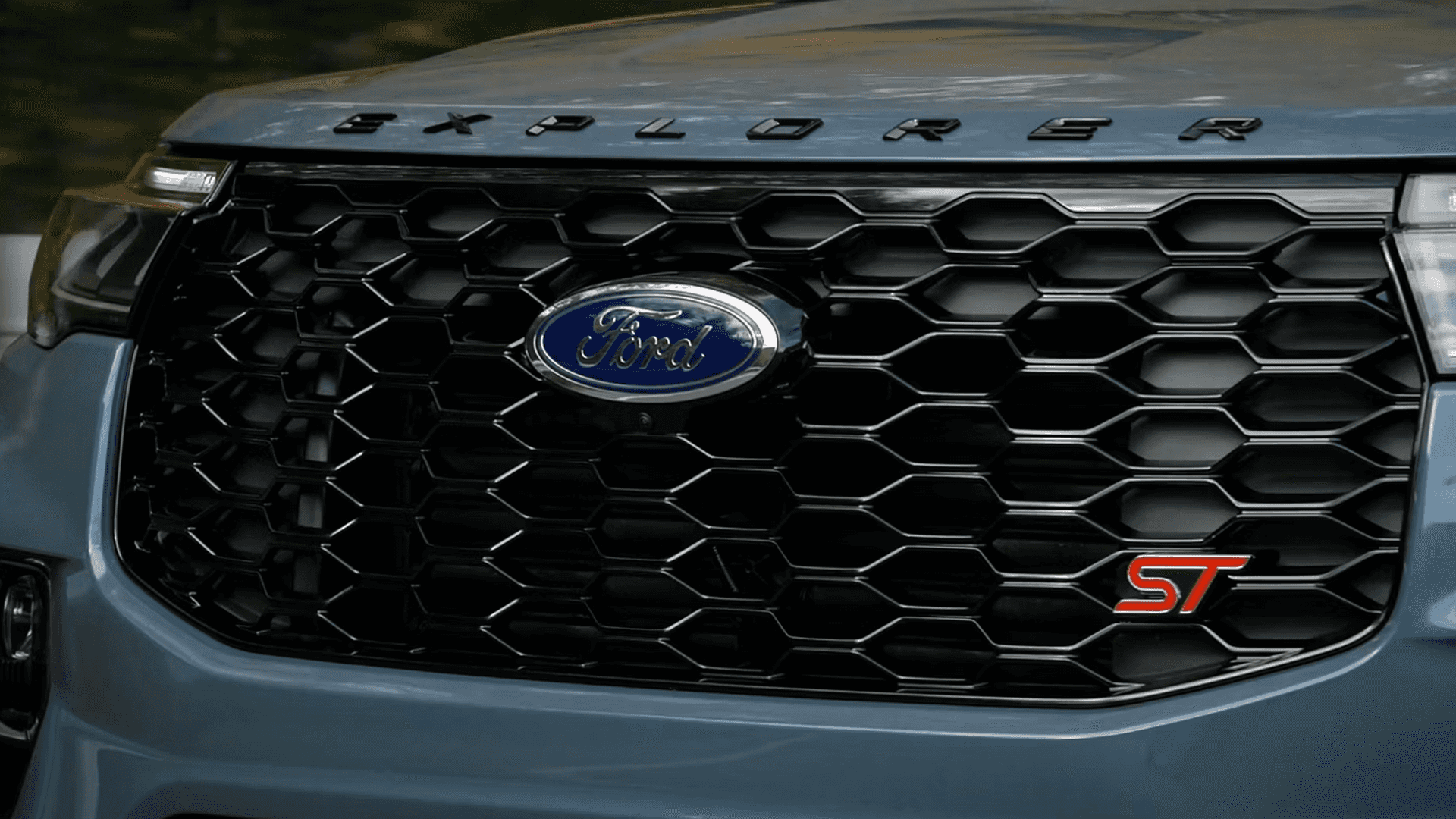 Front grille close-up of 2026 Ford Explorer ST with bold mesh design and ST badge detail