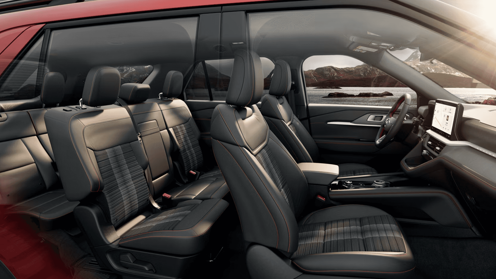 Side view of 2026 Ford Explorer cabin showing three rows, roomy seating, and dashboard screen