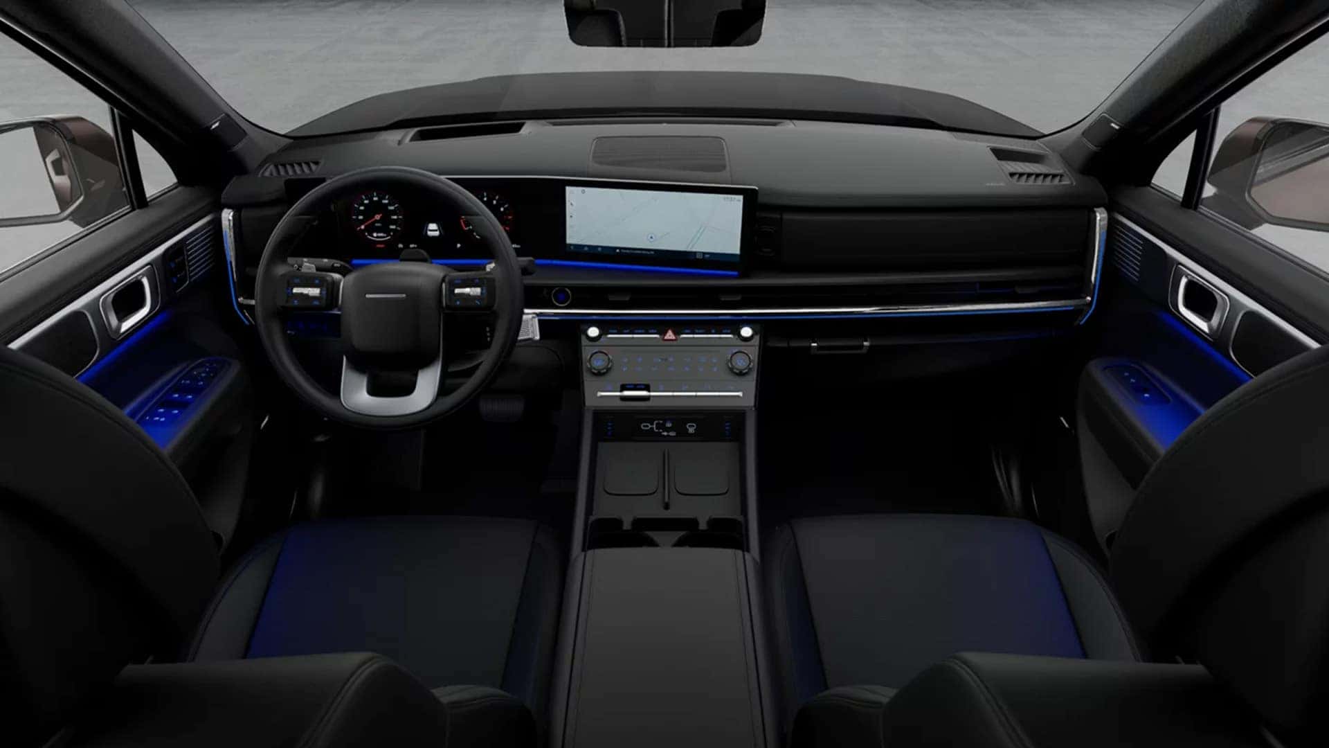 Dashboard view in the 2026 Hyundai Santa Fe interior highlighting the digital instrument cluster, infotainment display, and ambient lighting