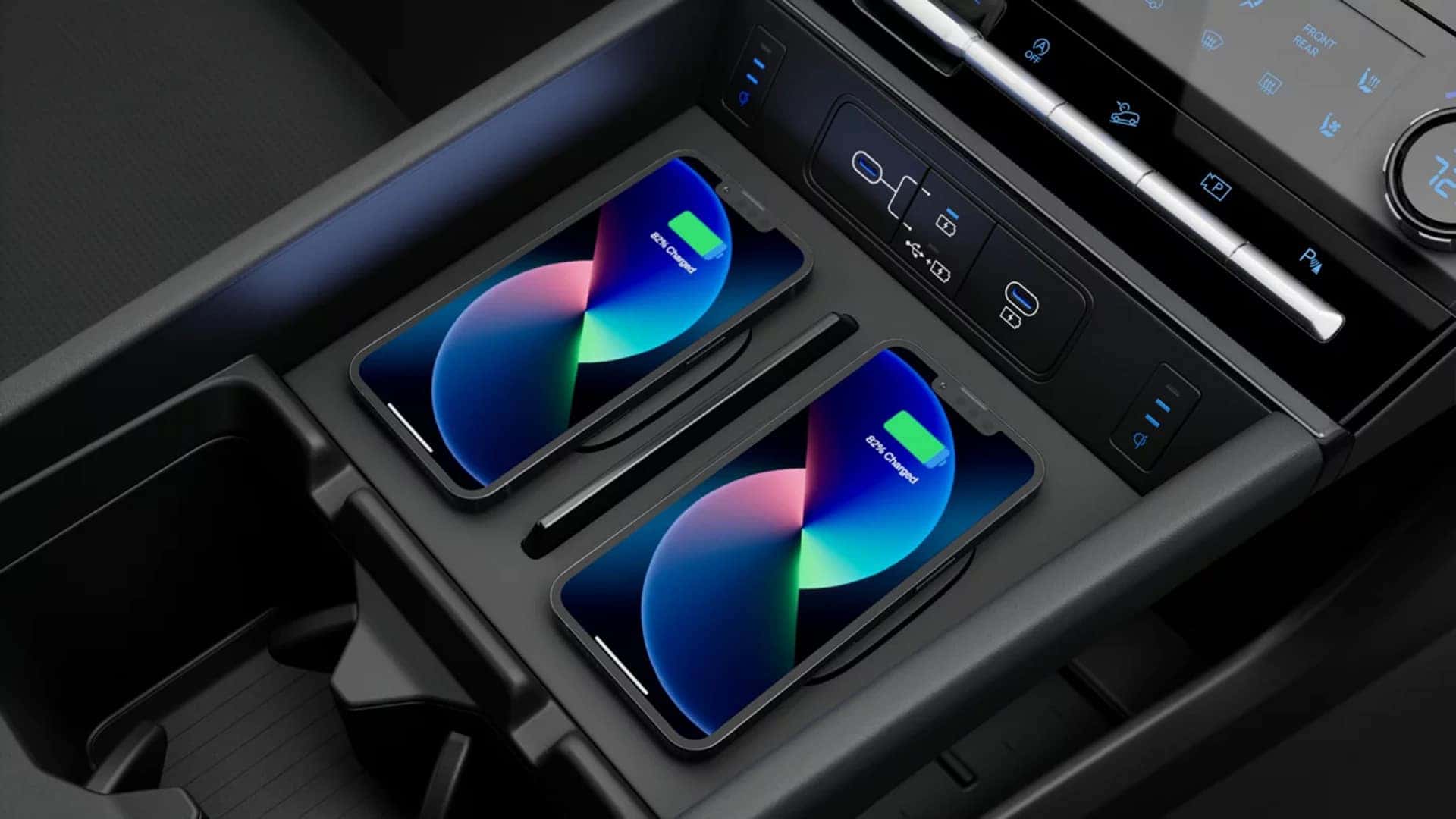 Dual wireless phone charging pads and USB charging ports inside the center console of the 2026 Hyundai Santa Fe