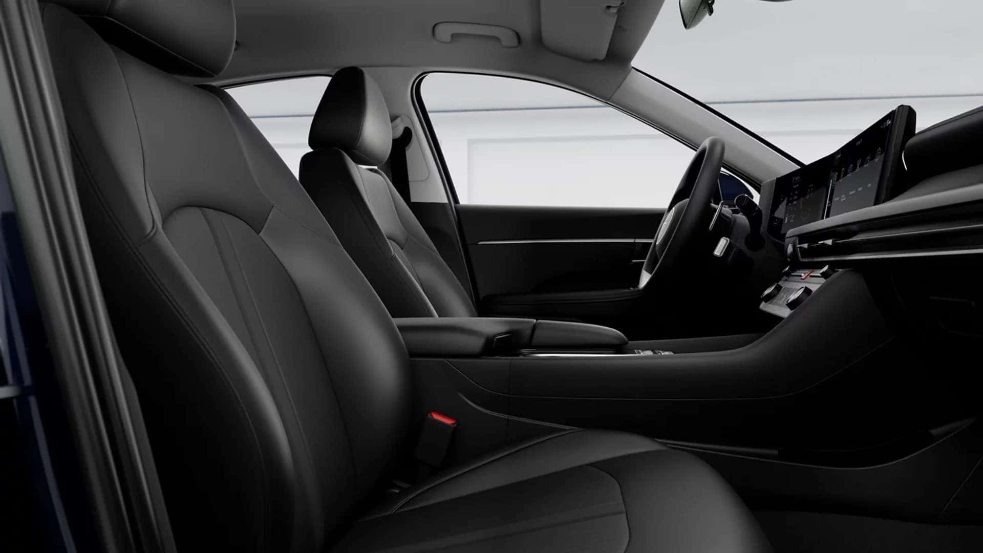 Front interior of the 2026 Hyundai Sonata Hybrid featuring contoured seats, center console layout, and driver focused cabin design