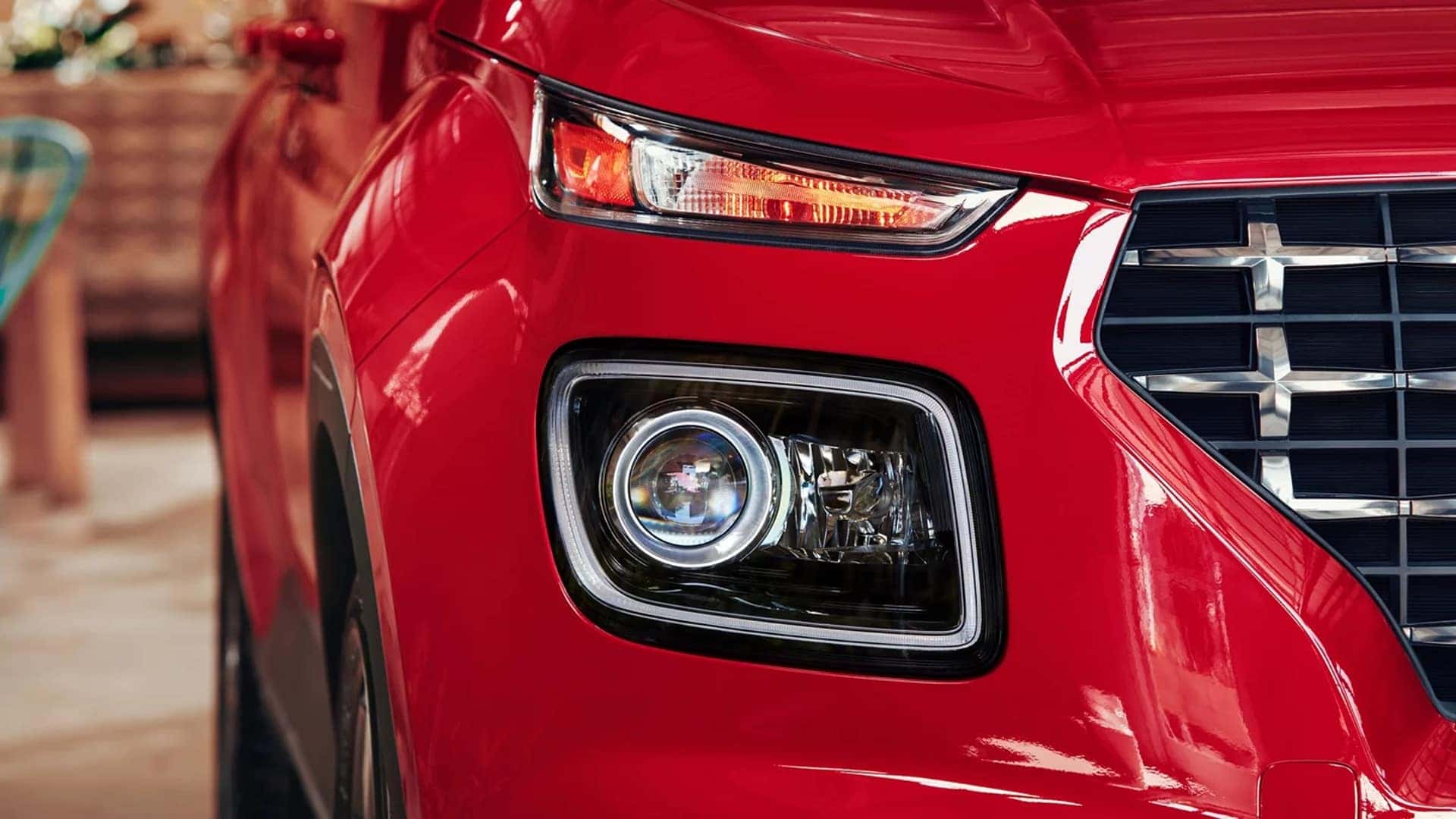 Close up of 2026 Hyundai Venue front end showing grille design, headlight styling, and LED daytime running lights.