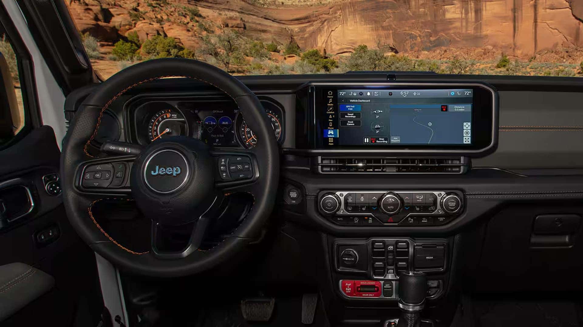 2026 Jeep Gladiator dashboard with steering wheel, gauge cluster, and large touchscreen navigation display