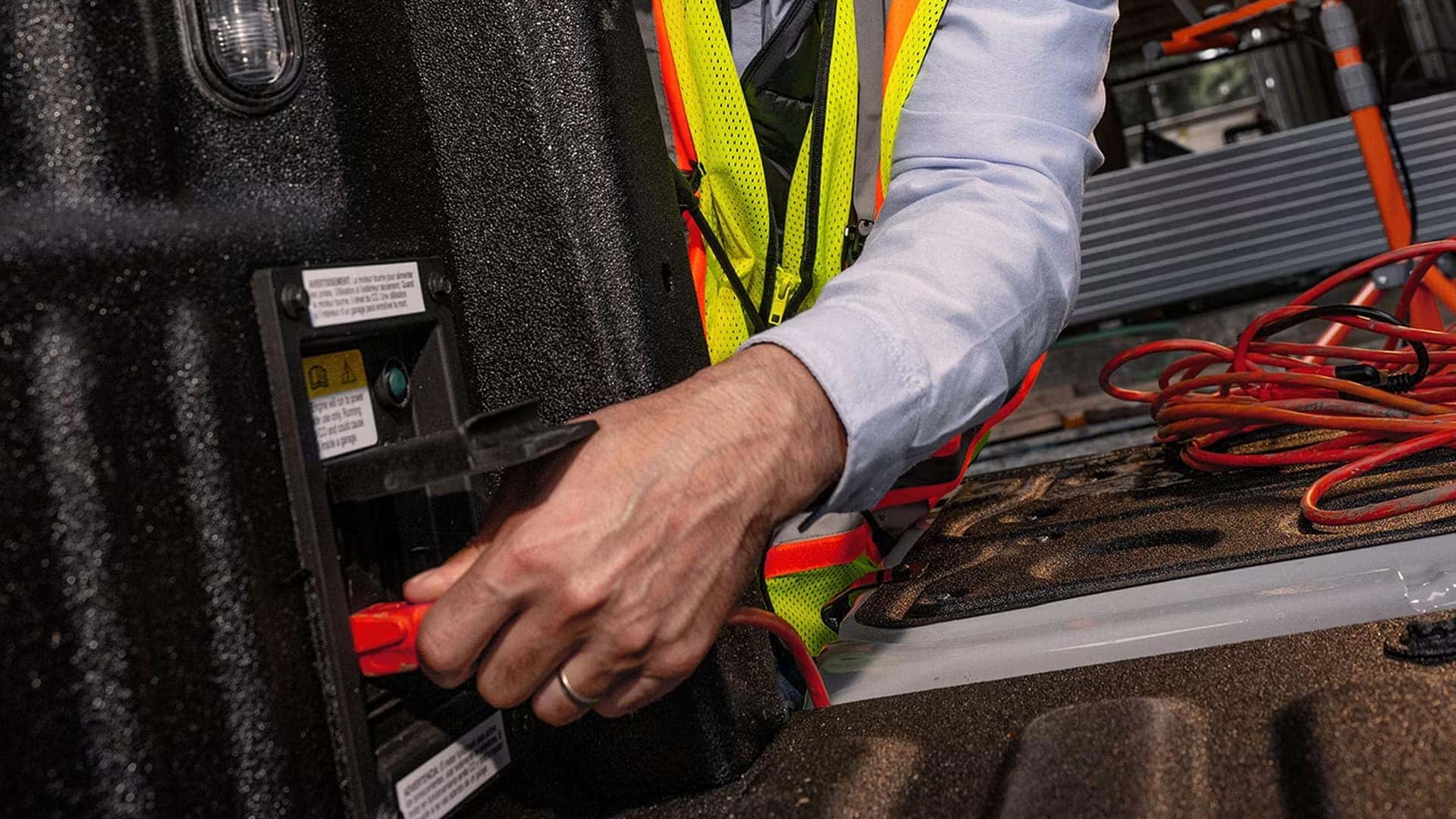 2026 Ford F-250 Super Duty Pro Power Onboard outlet in truck bed powering tools at a jobsite