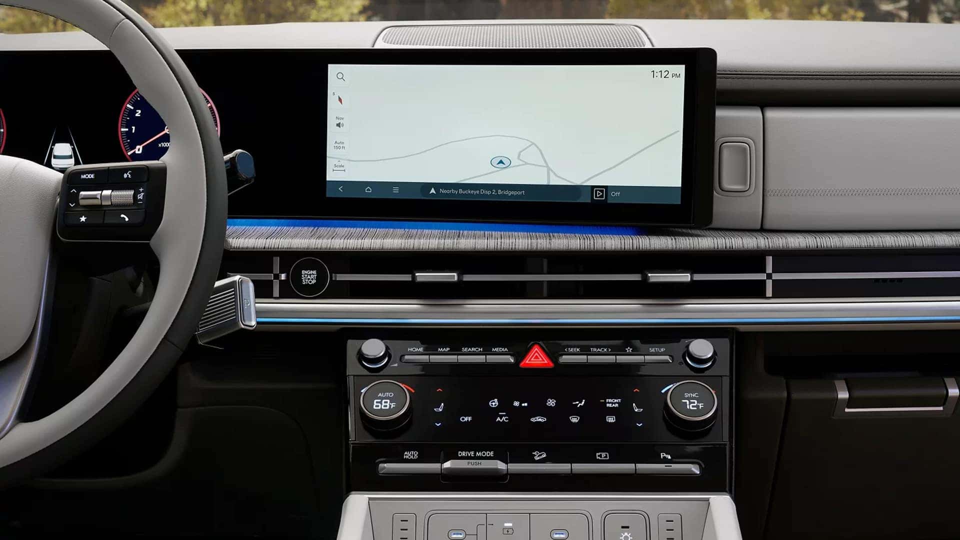 Dashboard view of the 2026 Hyundai Santa Fe showing a wide digital display, navigation screen, climate controls, and modern interior technology