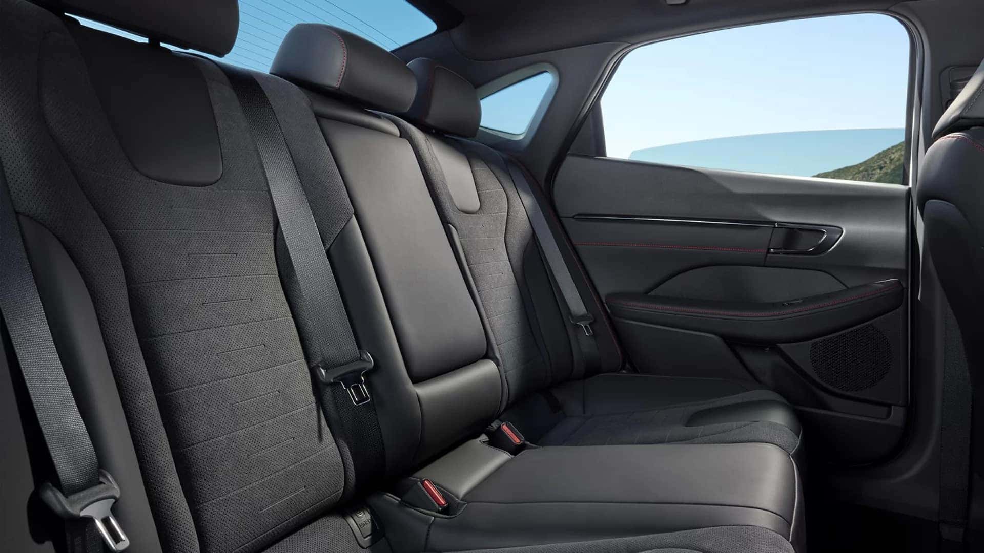 Rear seating area of the 2026 Hyundai Sonata showing split bench seat design, headrests, and door panel detailing.