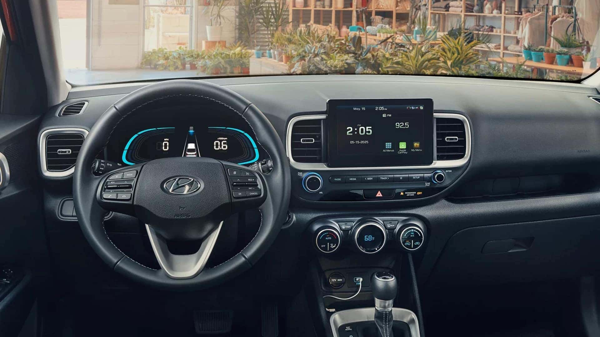 2026 Hyundai Venue dashboard with steering wheel, digital display, and touchscreen infotainment screen for connectivity and media