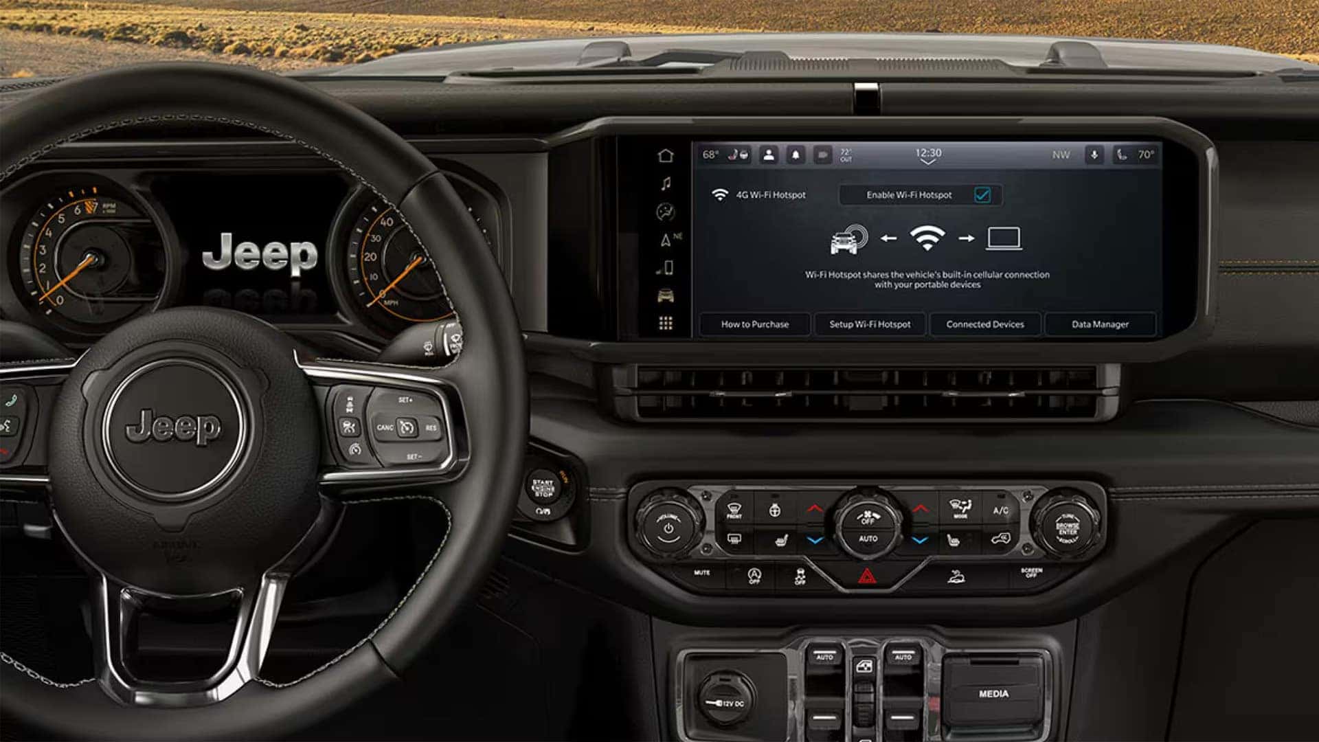 Close-up of 2026 Jeep Wrangler dashboard featuring 12.3-inch touchscreen with Uconnect infotainment system
