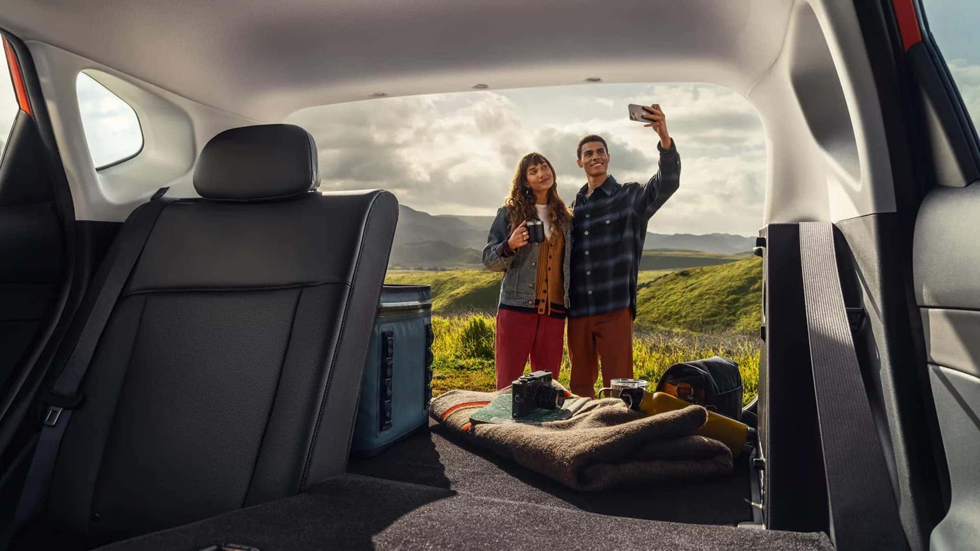 Rear cargo area of the 2026 Hyundai Kona with rear seats folded down to show expanded cargo space