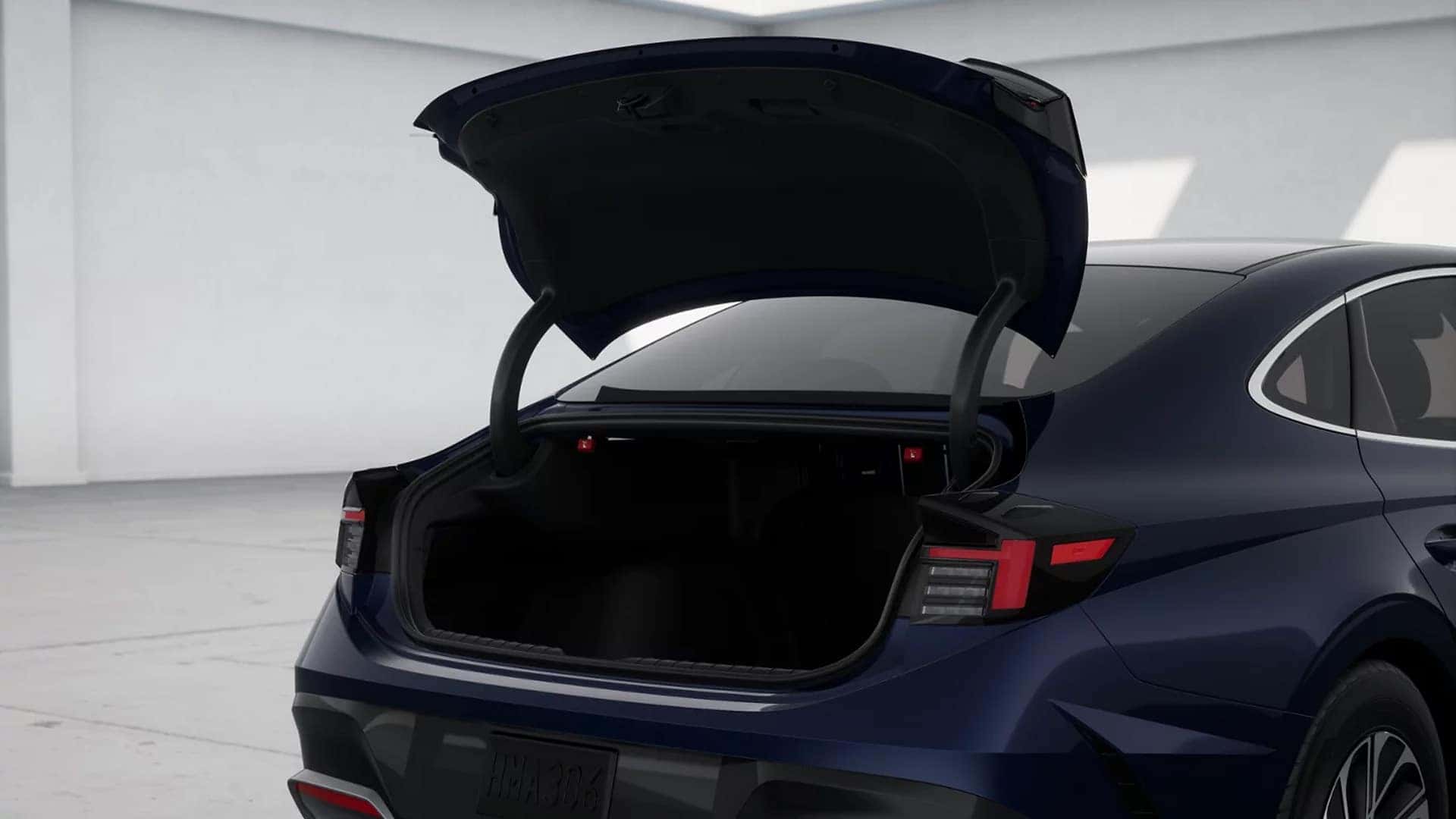 Open trunk of the 2026 Hyundai Sonata Hybrid showing cargo space and wide trunk opening for luggage and daily storage
