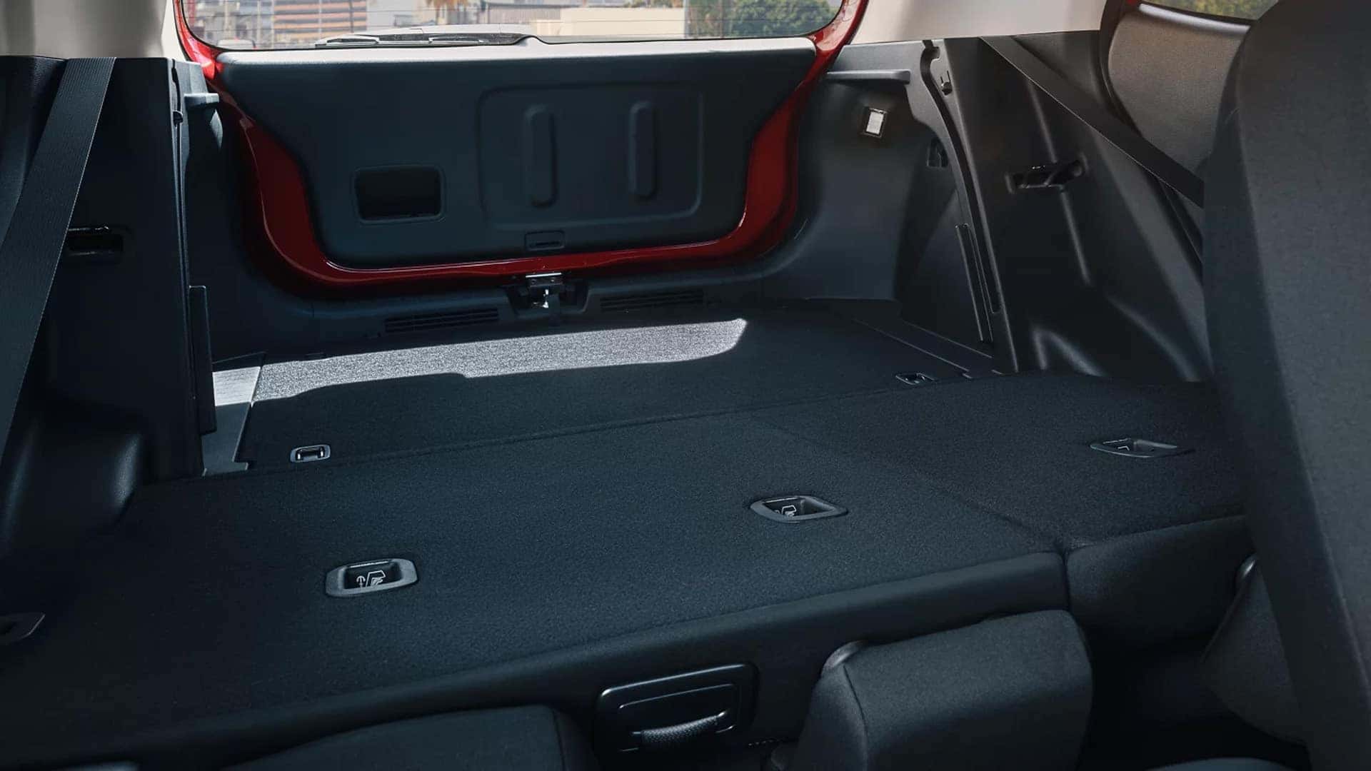Cargo area in the 2026 Hyundai Venue with rear seats folded down to show a flat load floor and expanded storage space.