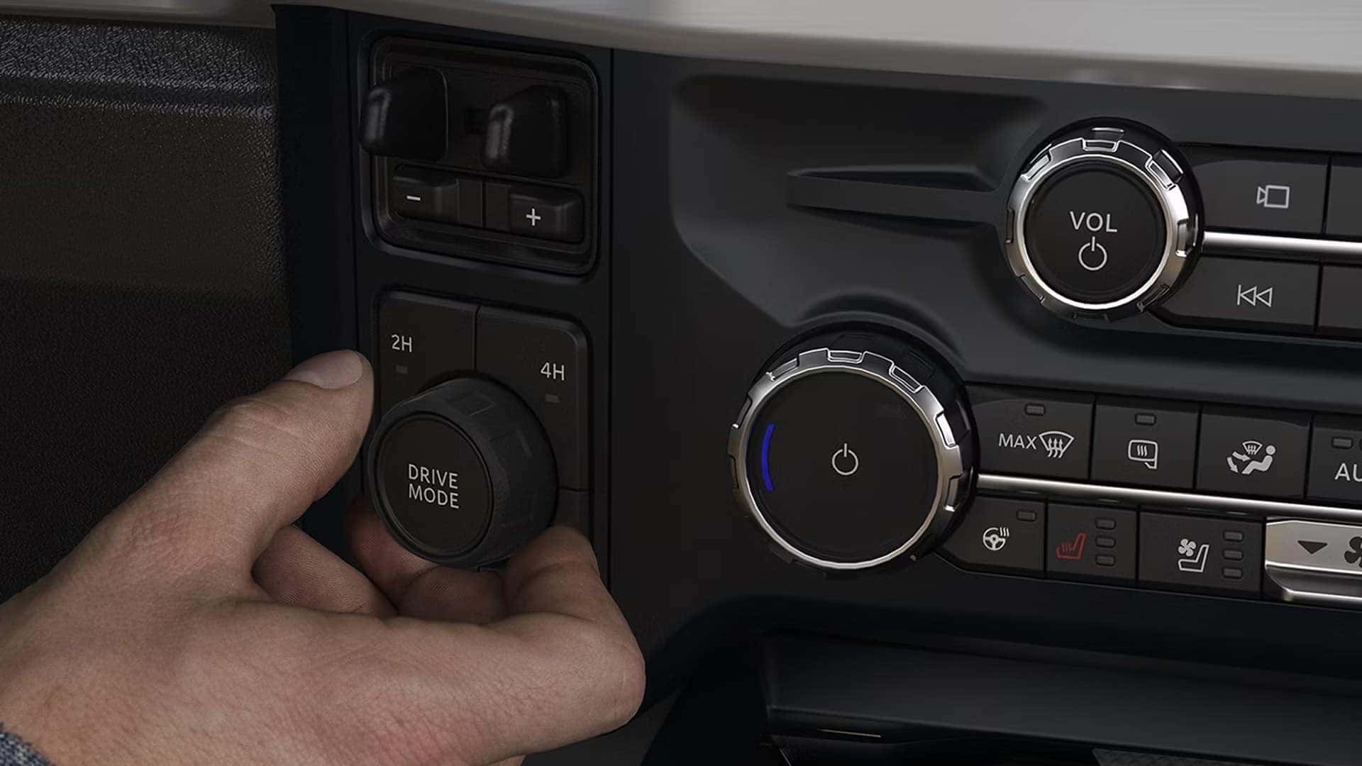 Available interior work surface inside the 2026 Ford F-250 Super Duty with a laptop set up on the fold-flat center console
