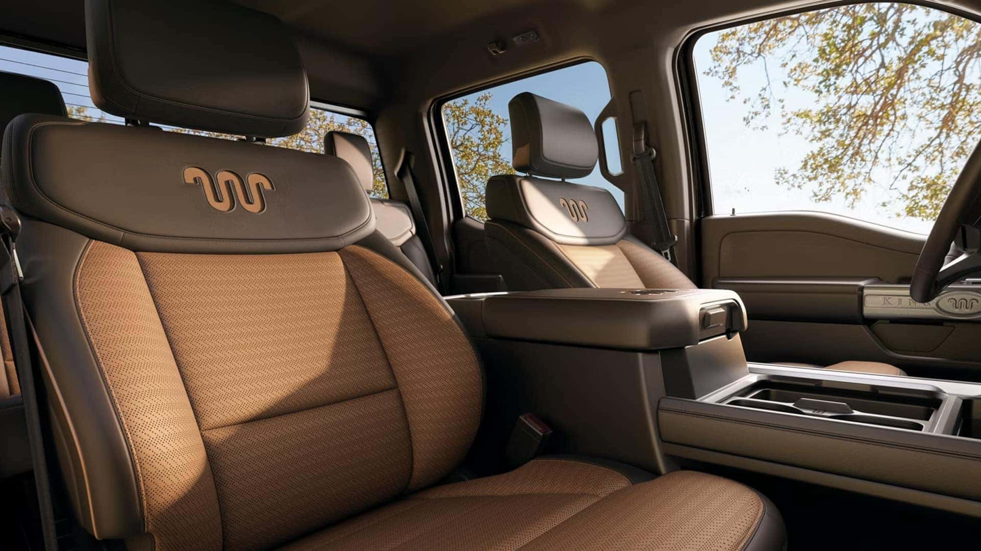 Premium leather front seats inside the 2026 Ford F-250 Super Duty King Ranch with distinctive stitching and upscale trim details