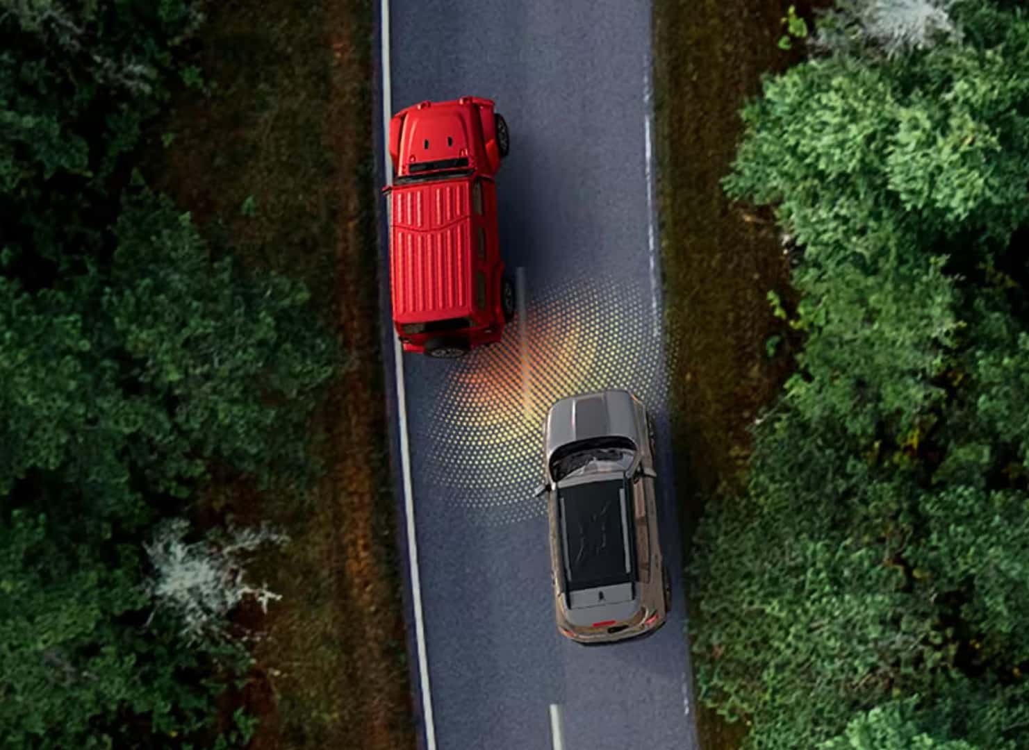 Aerial view of 2026 Jeep Wrangler with Blind Spot Monitoring alert highlighting a vehicle in the adjacent lane