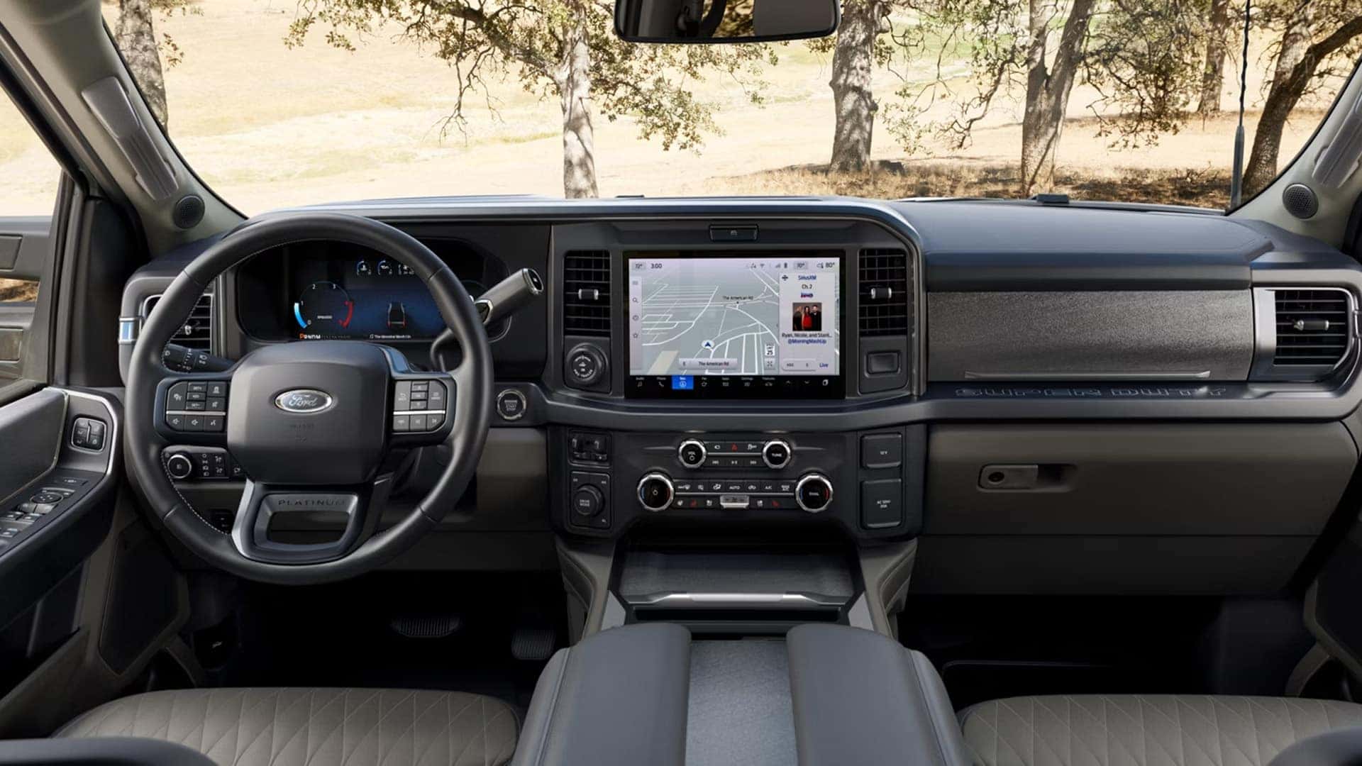 Wide dashboard view of the 2026 Ford F-250 Super Duty Platinum interior with large center touchscreen and digital instrument display