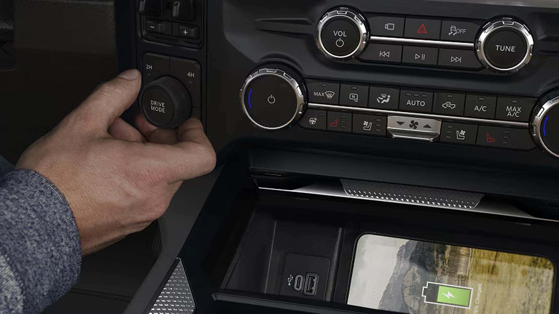 Drive mode selector and wireless charging pad in 2026 Ford F-250 Super Duty center console with USB ports and climate controls
