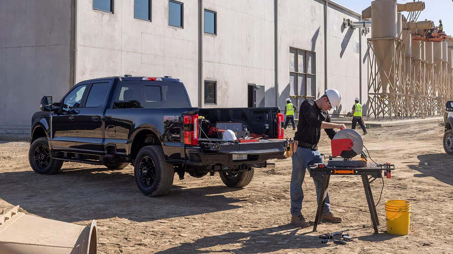 2026 Ford F-250 Super Duty parked at a construction site using Pro Power Onboard to run a miter saw