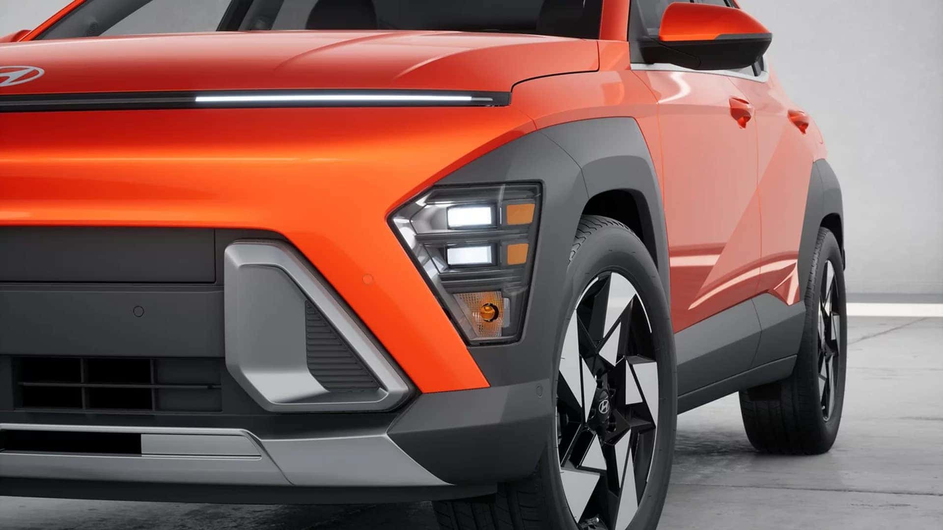 Close up of the front corner of a 2026 Hyundai Kona showing LED lighting elements, wheel design, and trim specific exterior details