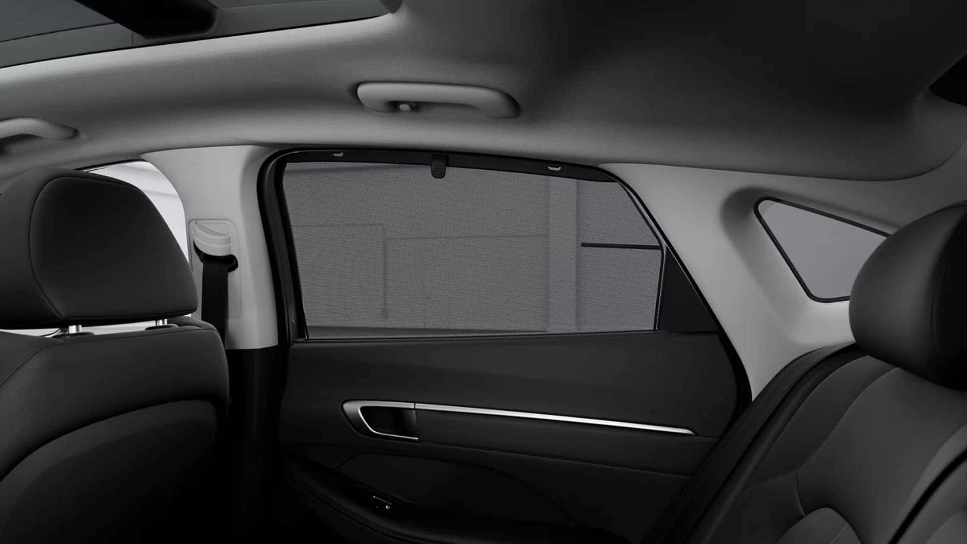 Rear passenger area of the 2026 Hyundai Sonata Hybrid showing legroom, door panel design, and rear seating layout