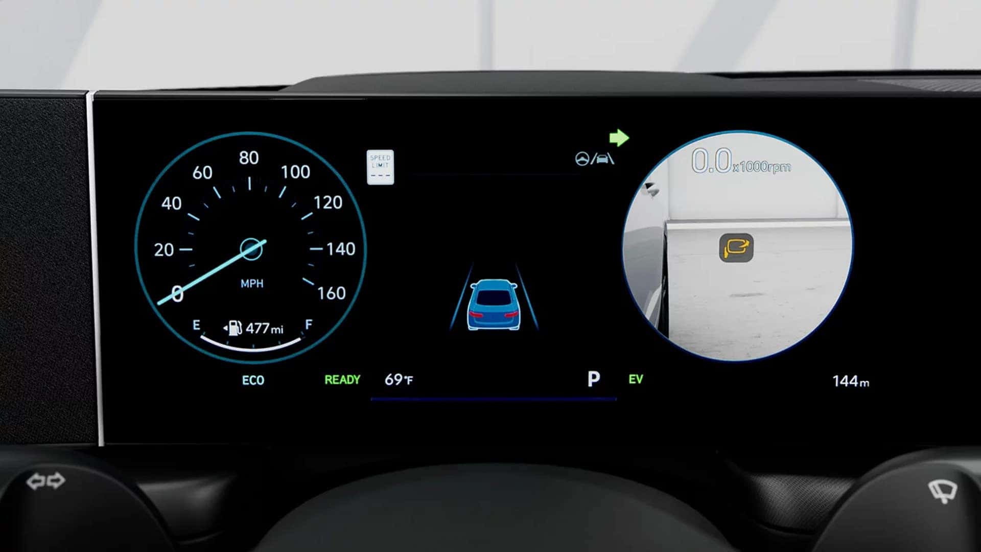 Digital instrument cluster in the 2026 Hyundai Sonata Hybrid displaying Blind Spot View Monitor camera feed alongside speedometer and hybrid system indicators