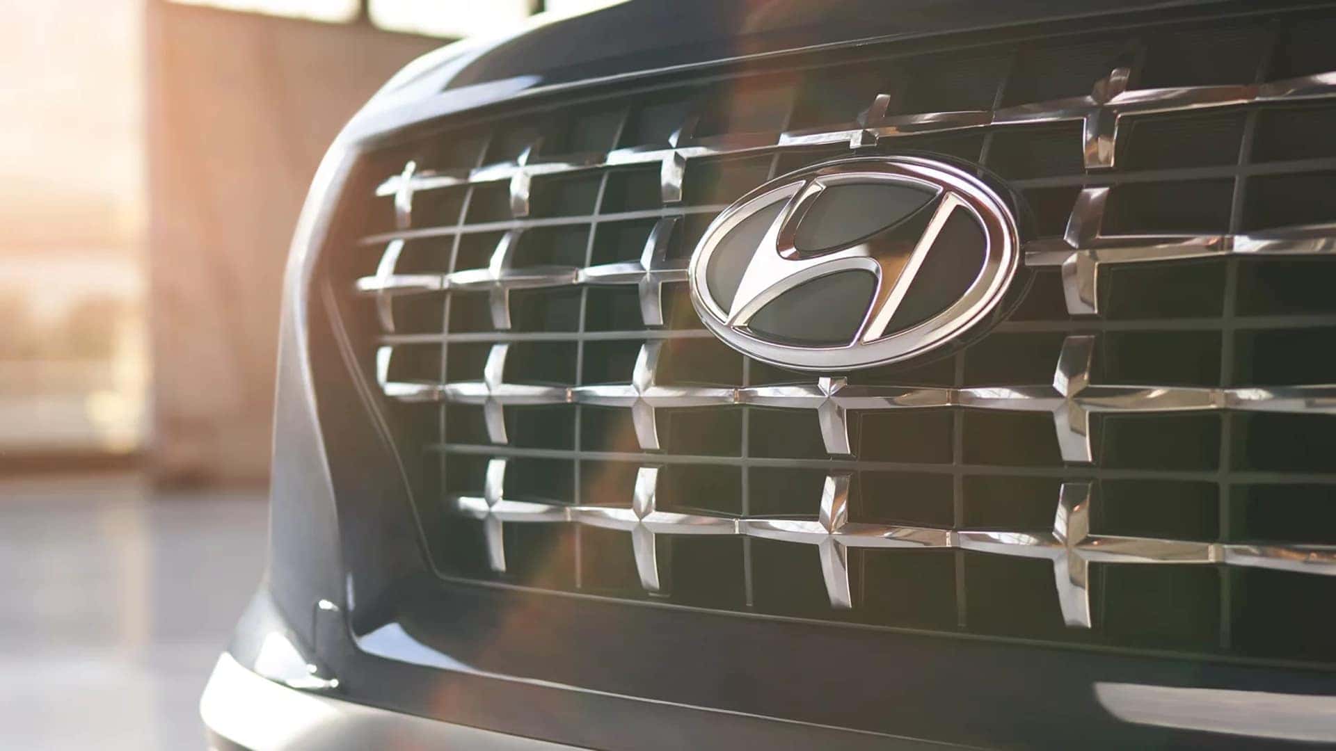 Detailed view of 2026 Hyundai Venue front grille with Hyundai emblem and patterned grille finish.