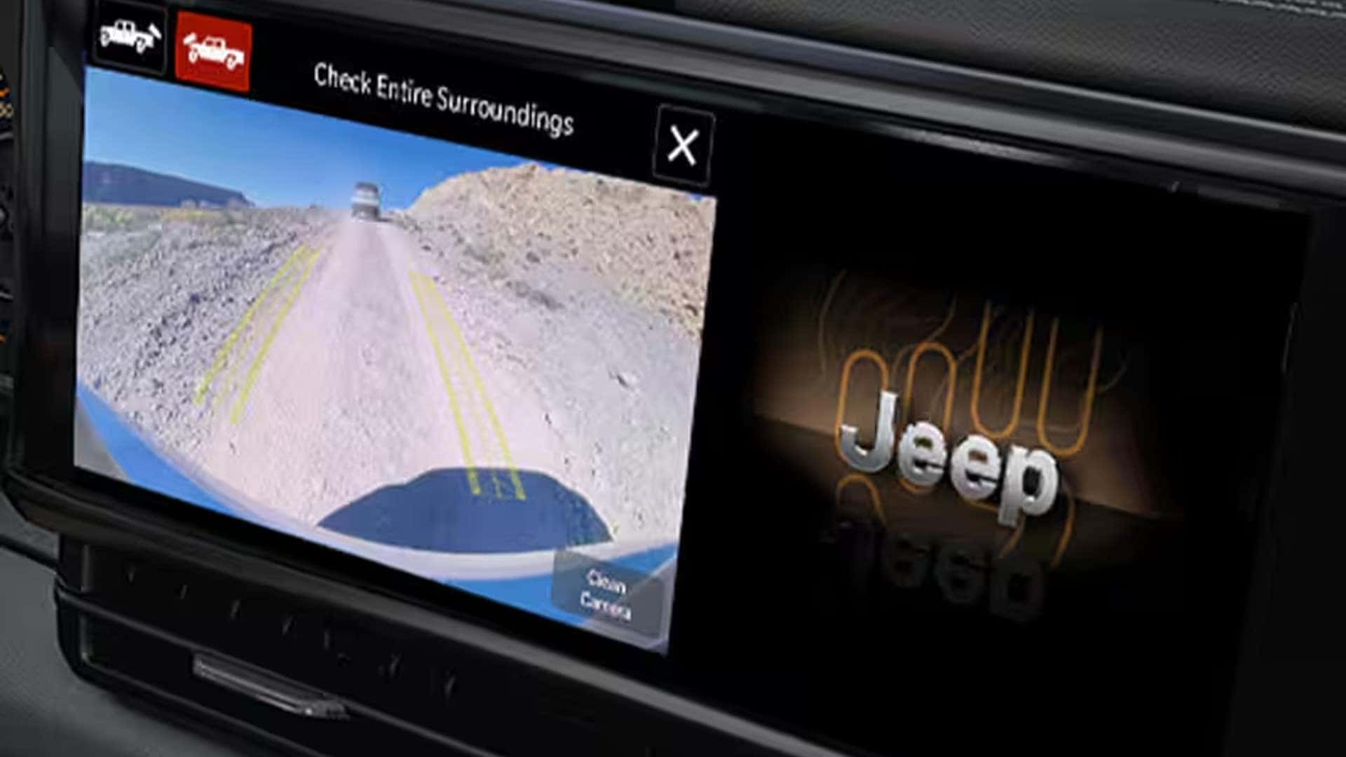 ParkView Rear Back Up Camera display in the 2026 Jeep Gladiator with dynamic gridlines and trail terrain visible on screen