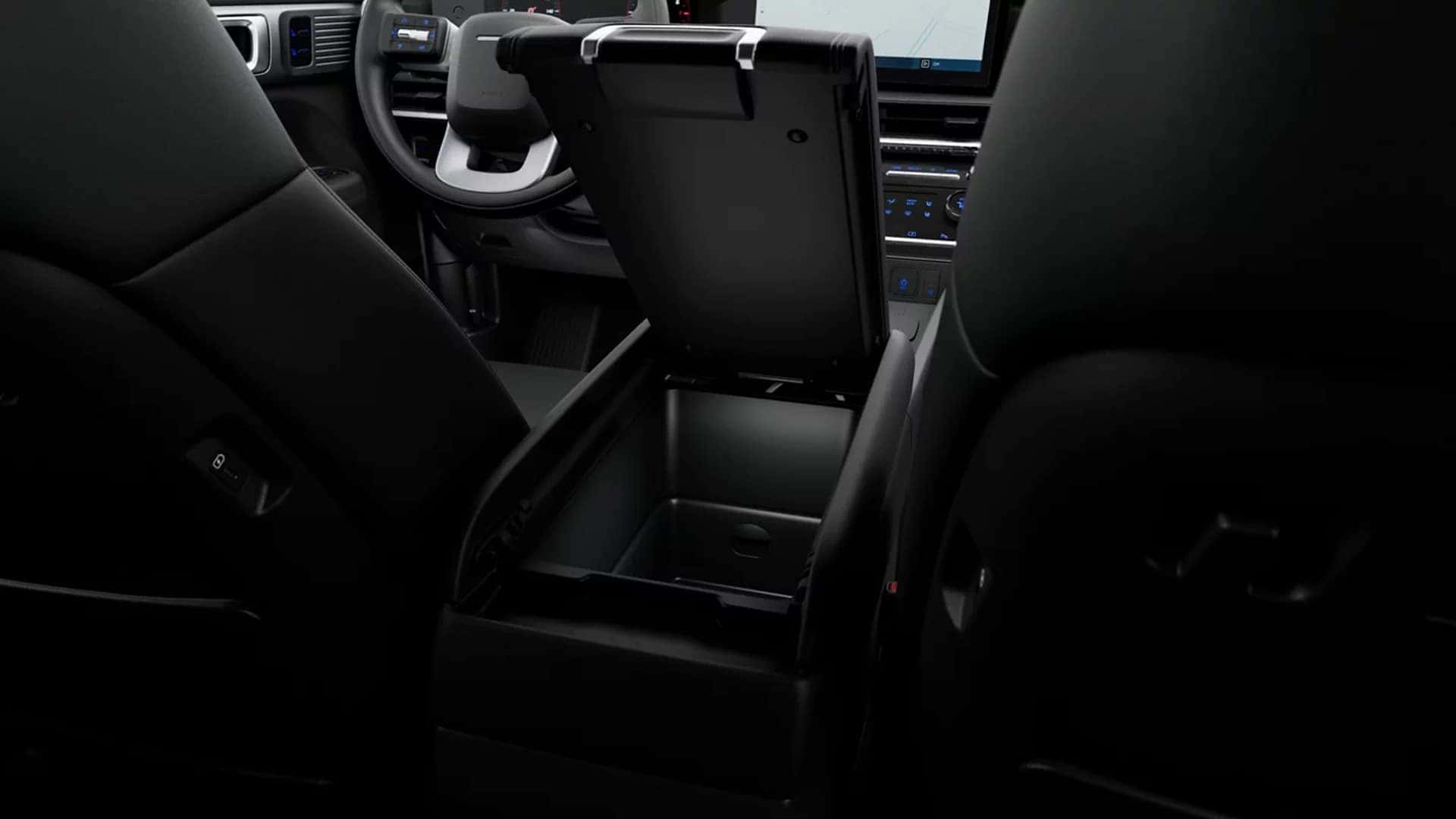 Interior view of the 2026 Hyundai Santa Fe XRT trim featuring dark seating surfaces, trim specific seat accents, and rugged cabin styling