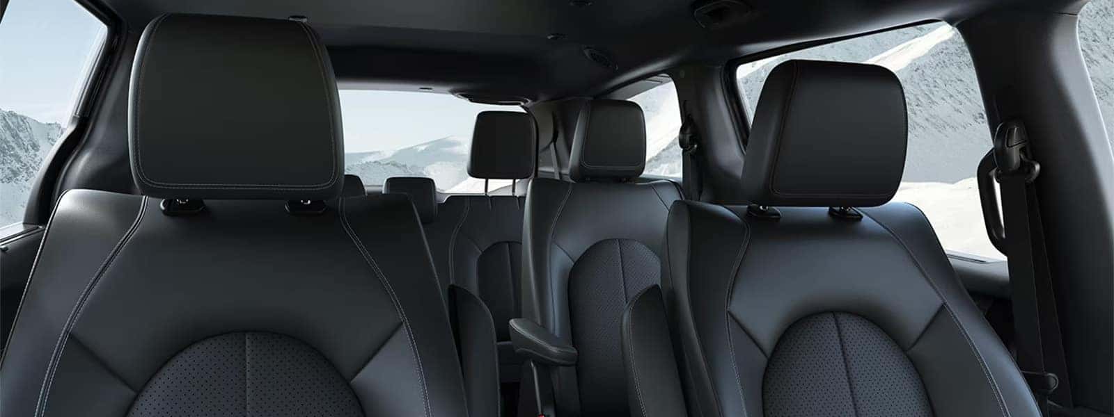2026 Chrysler Voyager interior with three-row seating, black Caprice leatherette seats, and spacious family cabin layout